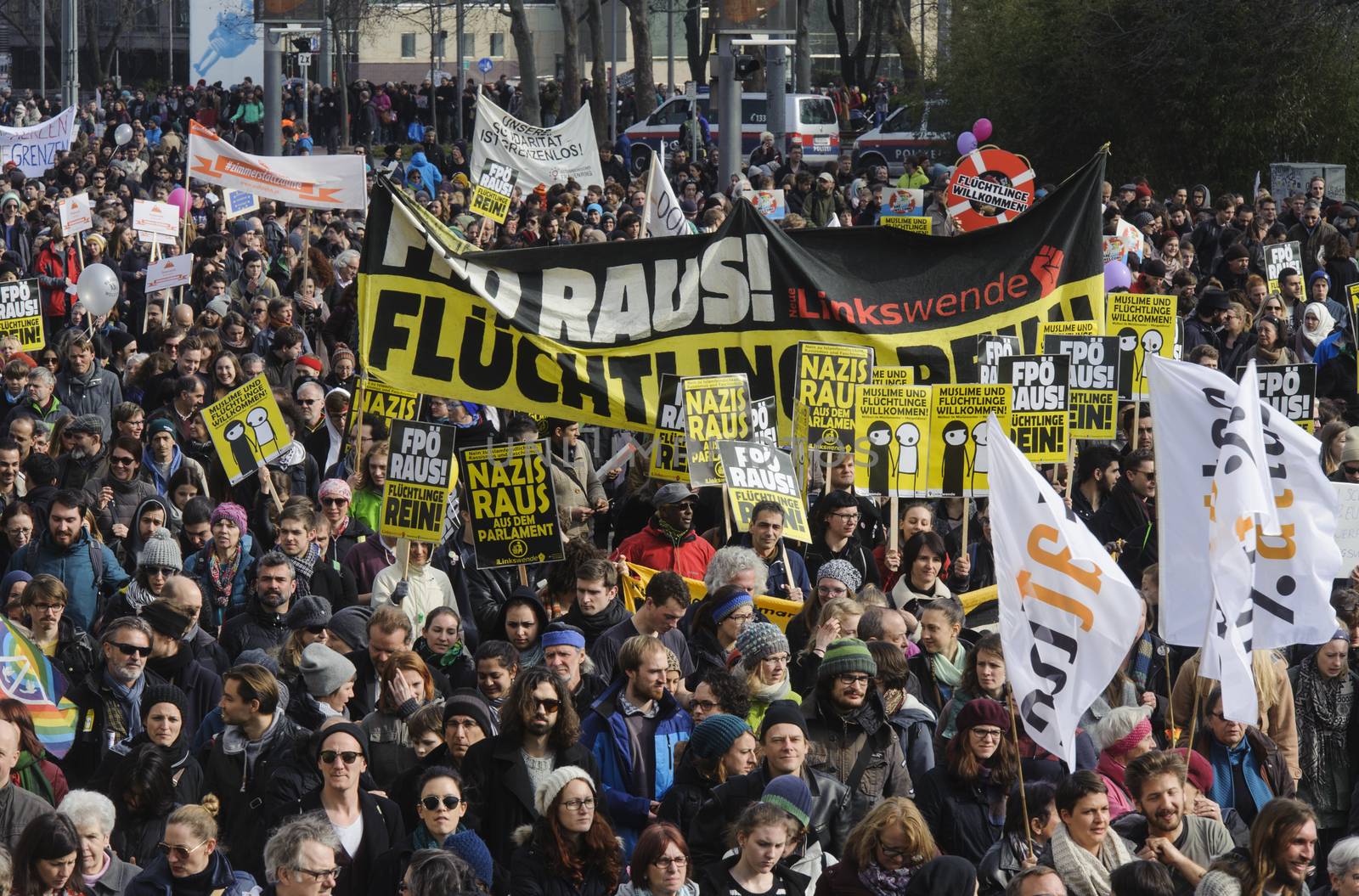 AUSTRIA, Vienna: Thousands march holding banners and waving flags on March 19, 2016 in Austria.The demonstrators have denounced 'fortress Europe' and demanded an end to racism. The demonstrators marched through Vienna, holding signs and waving flags.