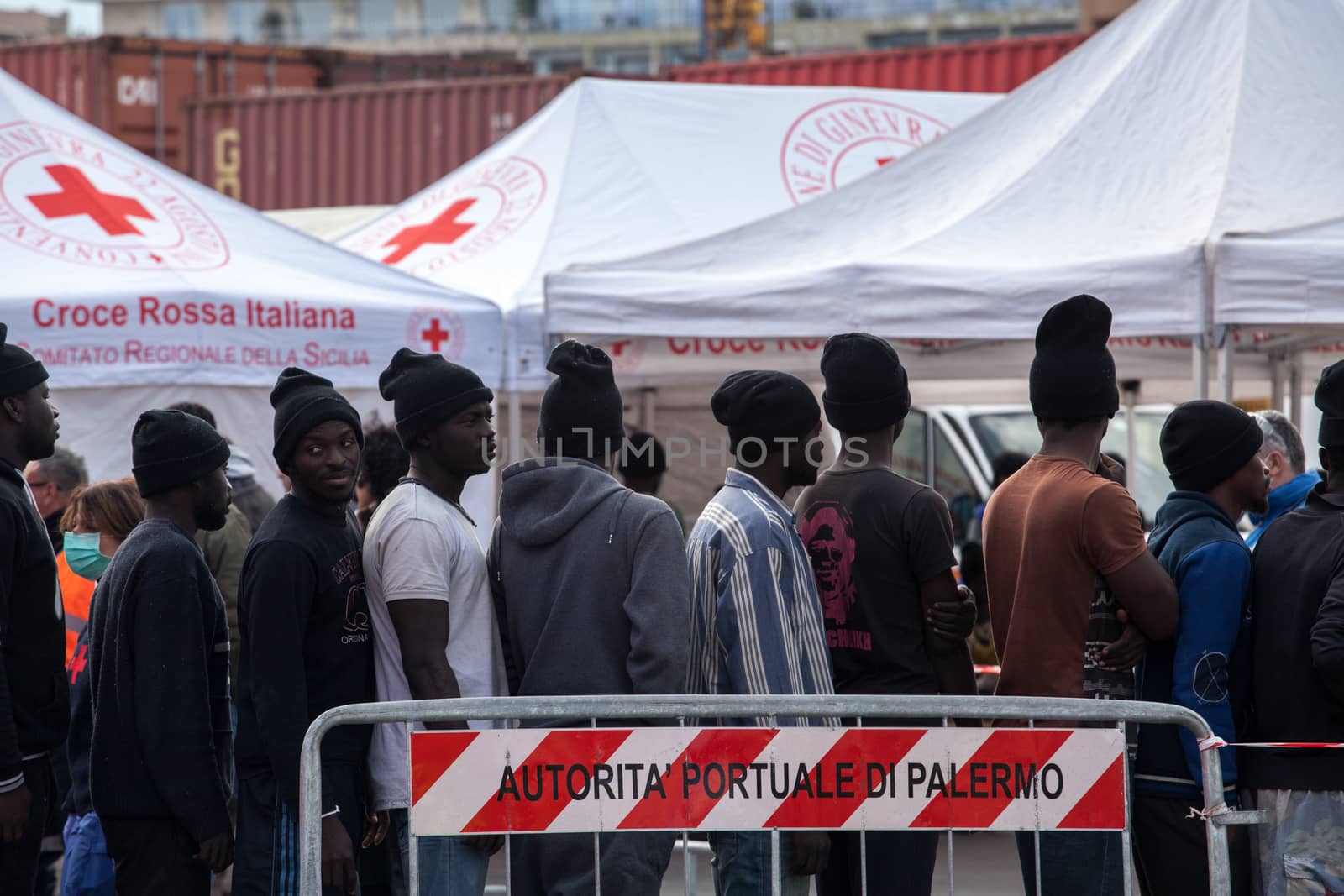 ITALY, Palermo: Migrants line up after getting off a ship in Palermo, Italy on March 19, 2016.712 migrants have arrived at the port of Palermo, on the military Norwegian ship Siem Pilot on March 19, 2016. Among them 598 men, 51 women, and 63 children came from 30 different nationalities including Nigeria, Senegal, Guinea, Sierra Leone and other Sub-saharan countries.