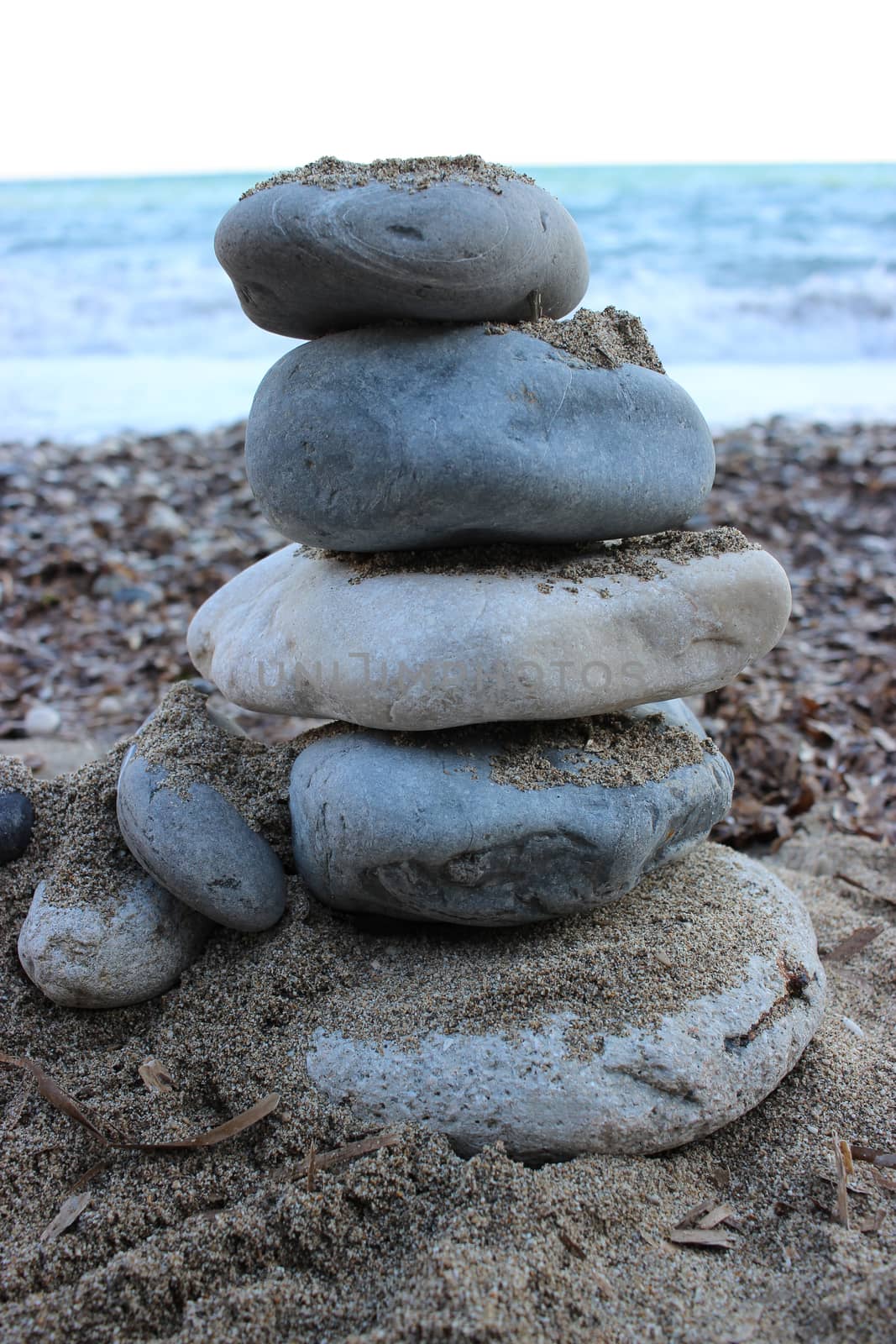 Stones Pyramid on The Beach Symbolizing Zen and Harmony