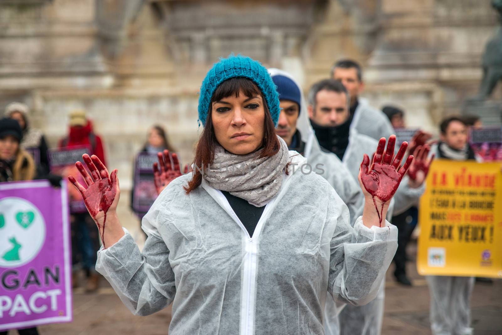 FRANCE, Paris: A member of the Vegan Impact association poses with bloody hands, during a demonstration commemorating International Day without Meat, at Saint-Michel square in Paris, on March 19, 2016.
