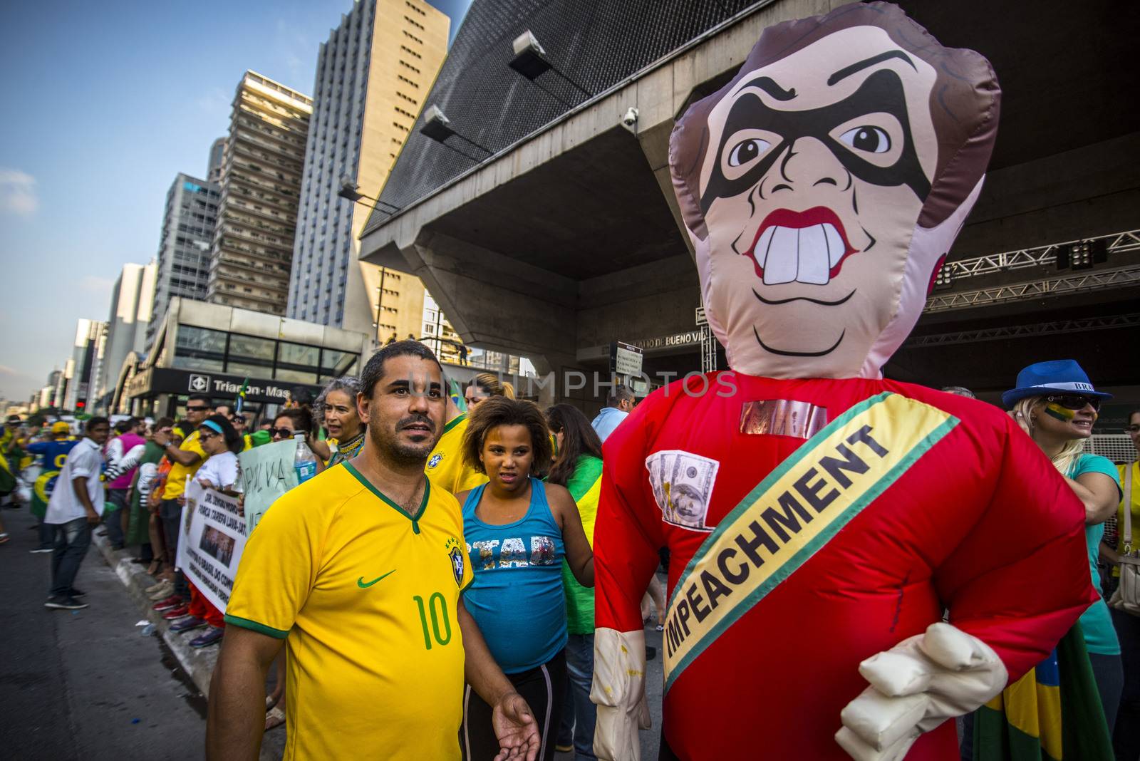 BRAZIL, Sao Paulo : Protesters stand next to a balloon with the effigy of President Dilma Rousseff during a demonstration against Brazilian former president (2003-2011) Luiz Inacio Lula da Silva in Sao Paulo, Brazil on March 19 2016. Brazilian lawmakers relaunched impeachment proceedings against President Dilma Rousseff Thursday and a judge blocked her bid to bring her powerful predecessor into her cabinet, intensifying the political crisis engulfing her. 