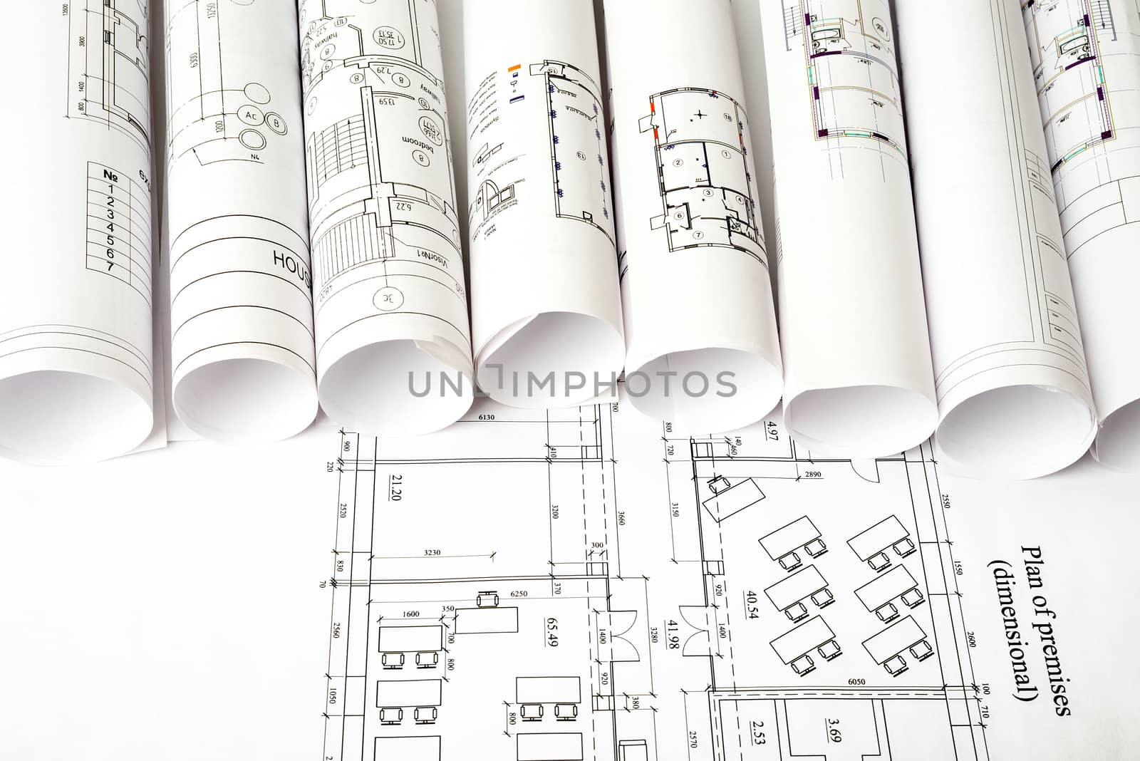 Architecture plan and rolls of blueprints, top view. Building concept