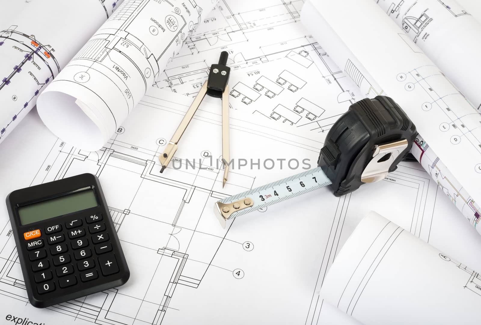 Architecture plan and rolls of blueprints with meter. Building concept