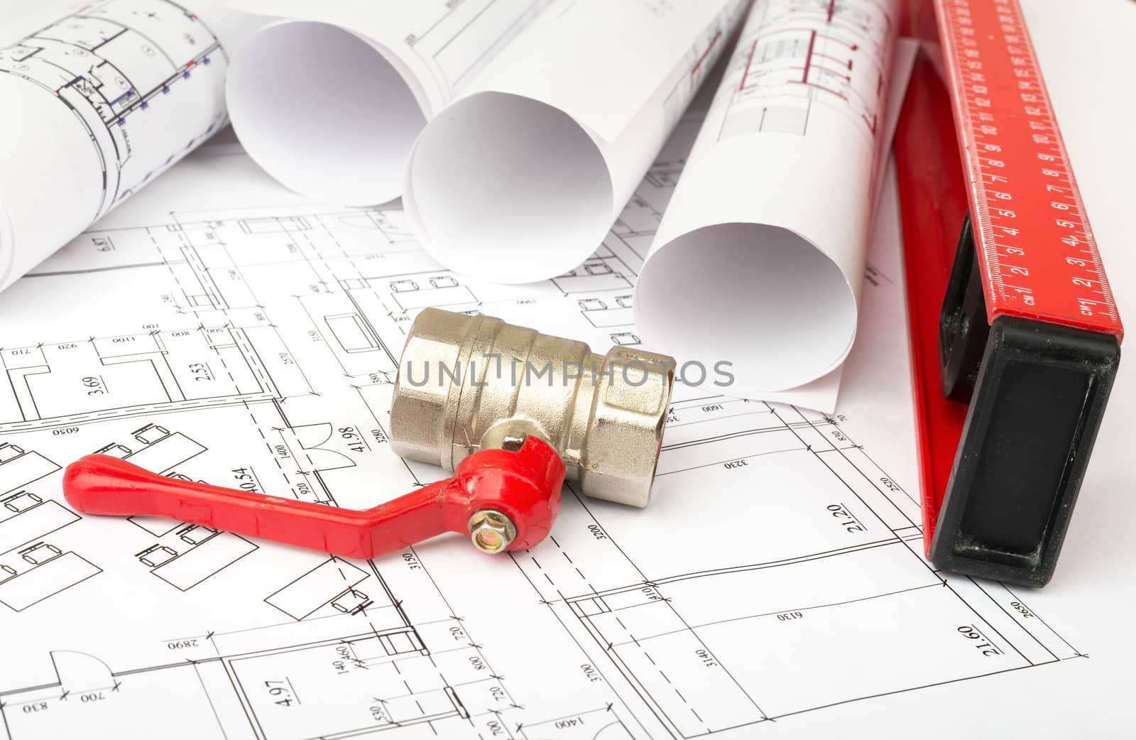 Architecture plan with red mixer tap and level. Building concept