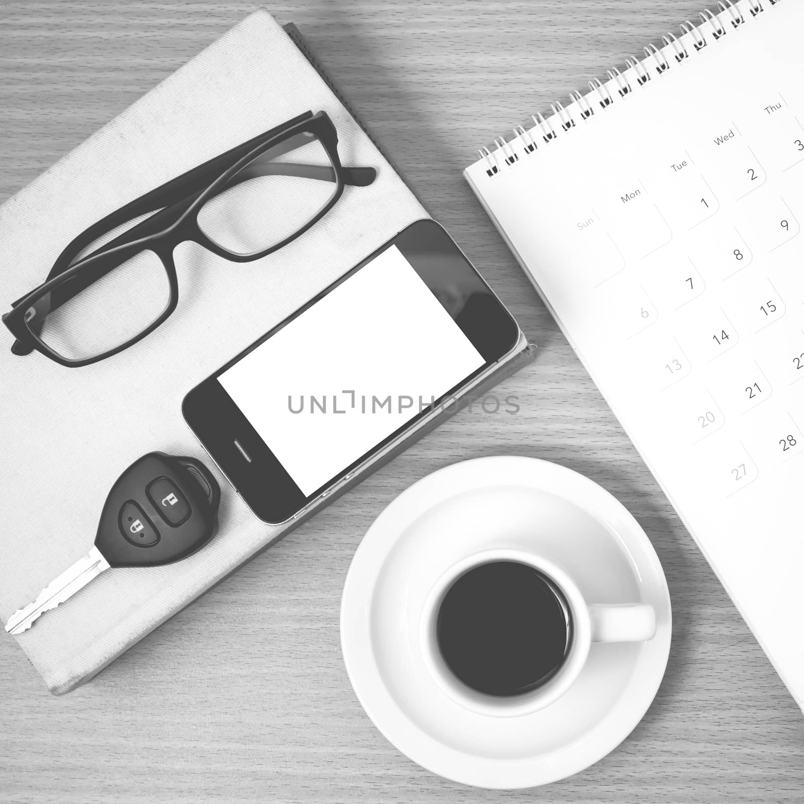 coffee and phone with car key,eyeglasses,stack of book,calendar  by ammza12