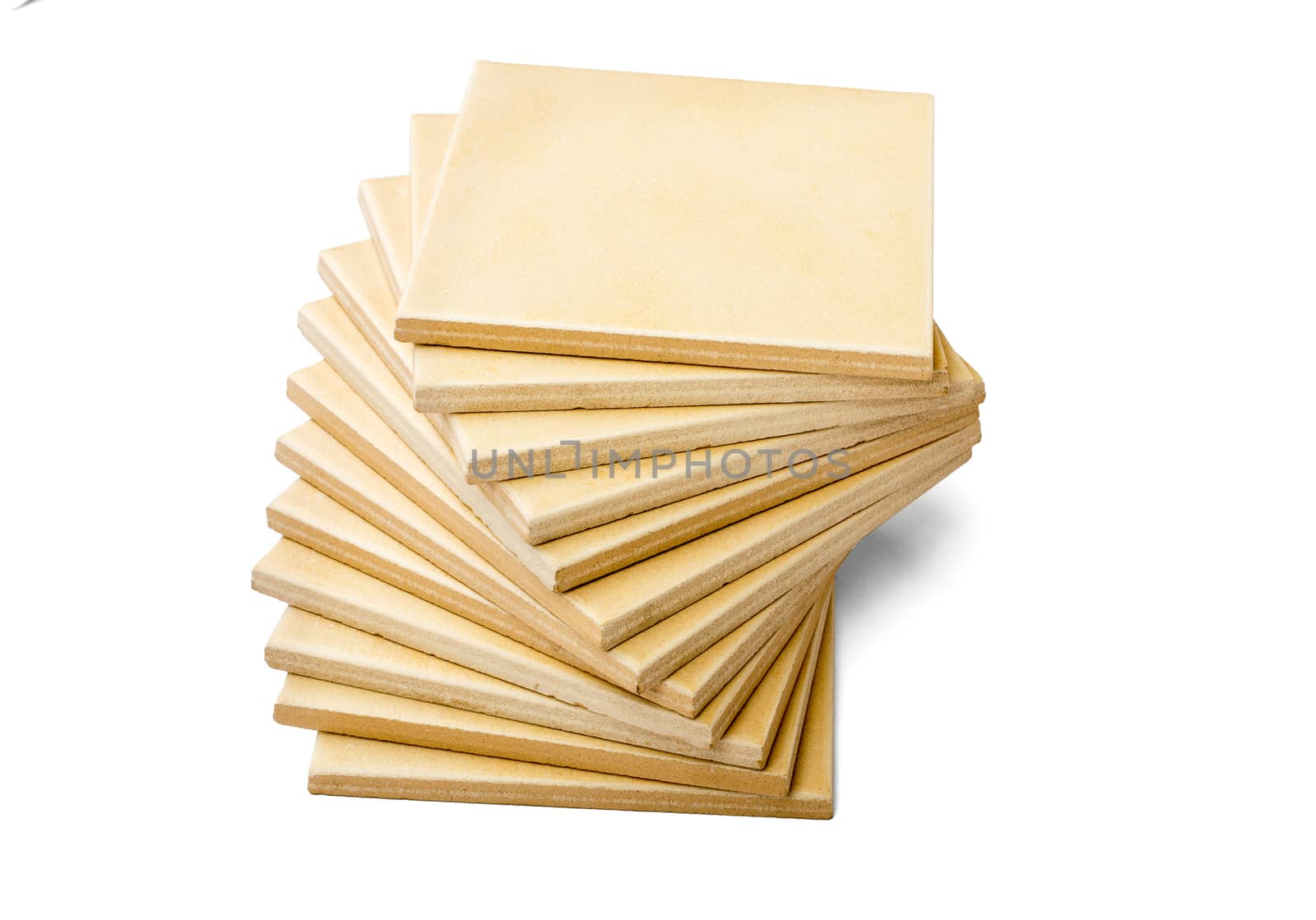 Pile of tiles isolated on white background, side view