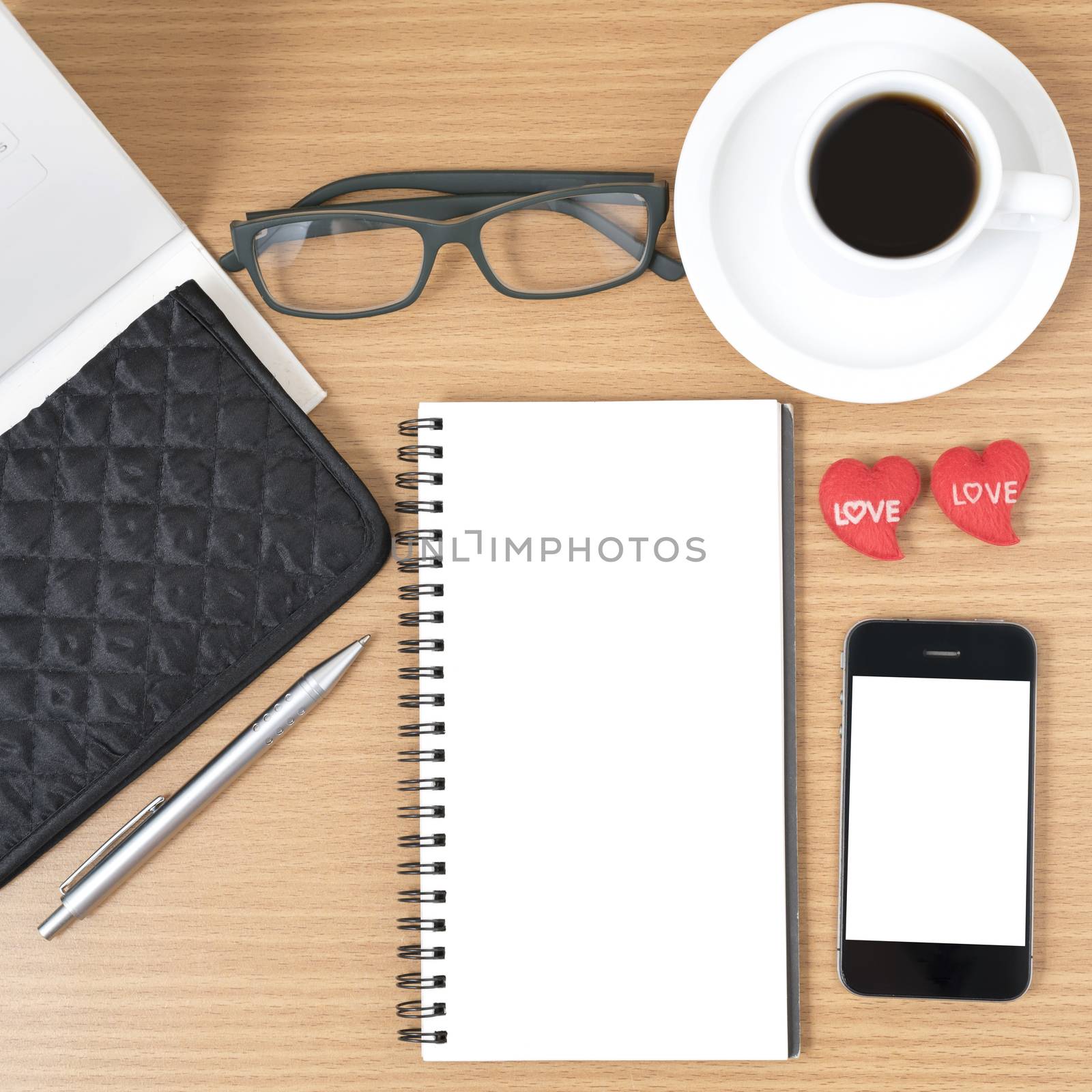 office desk : coffee with phone,wallet,calendar,heart,notepad,eyeglasses,heart on wood background