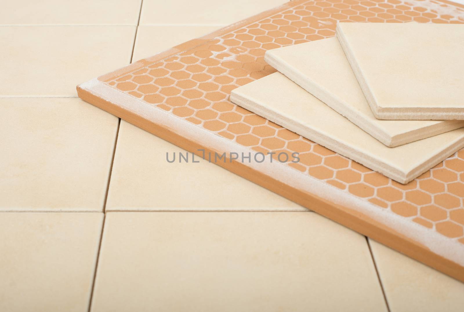 Set of tiles and tile wall isolated on floor, closeup