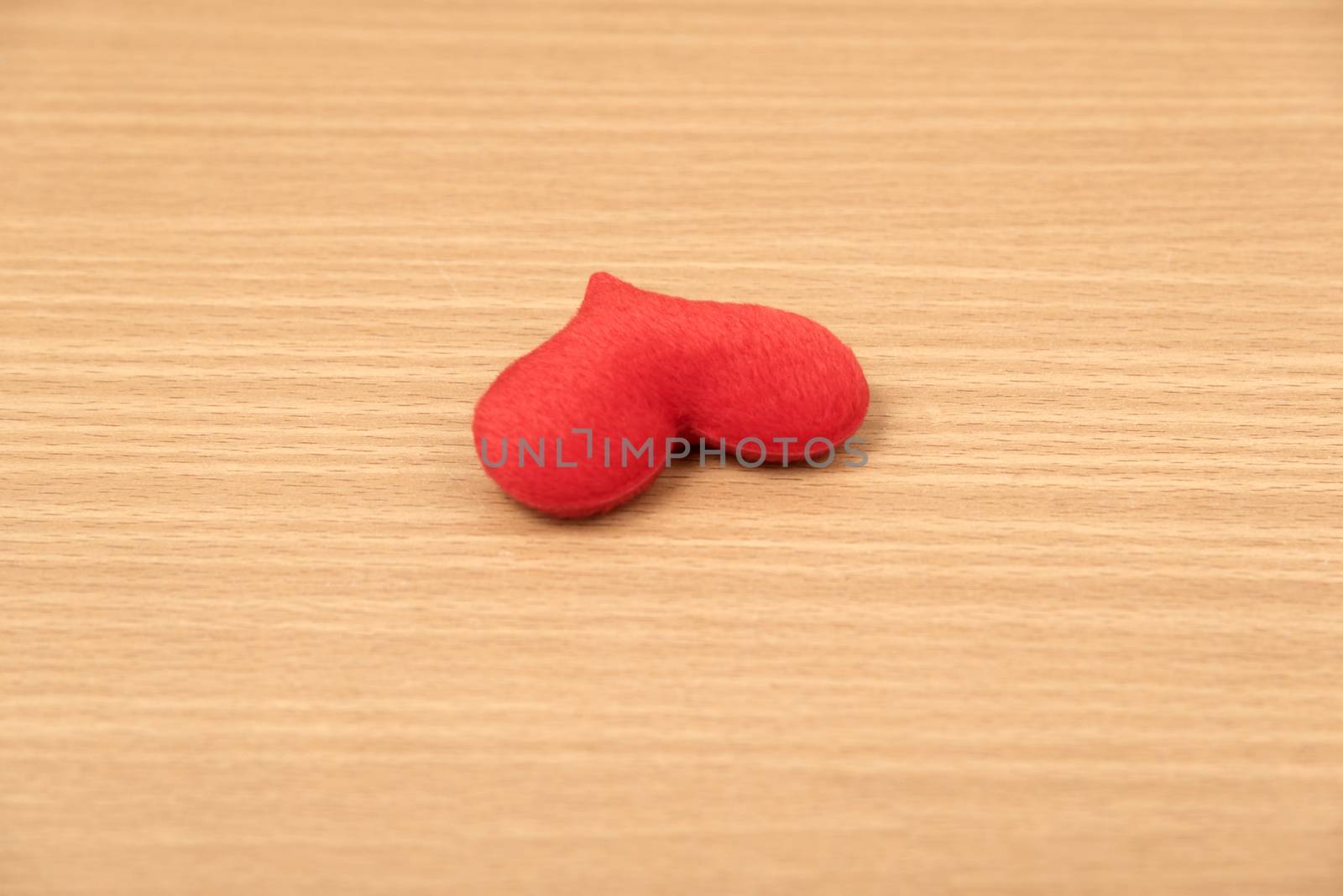 red heart on wood table background