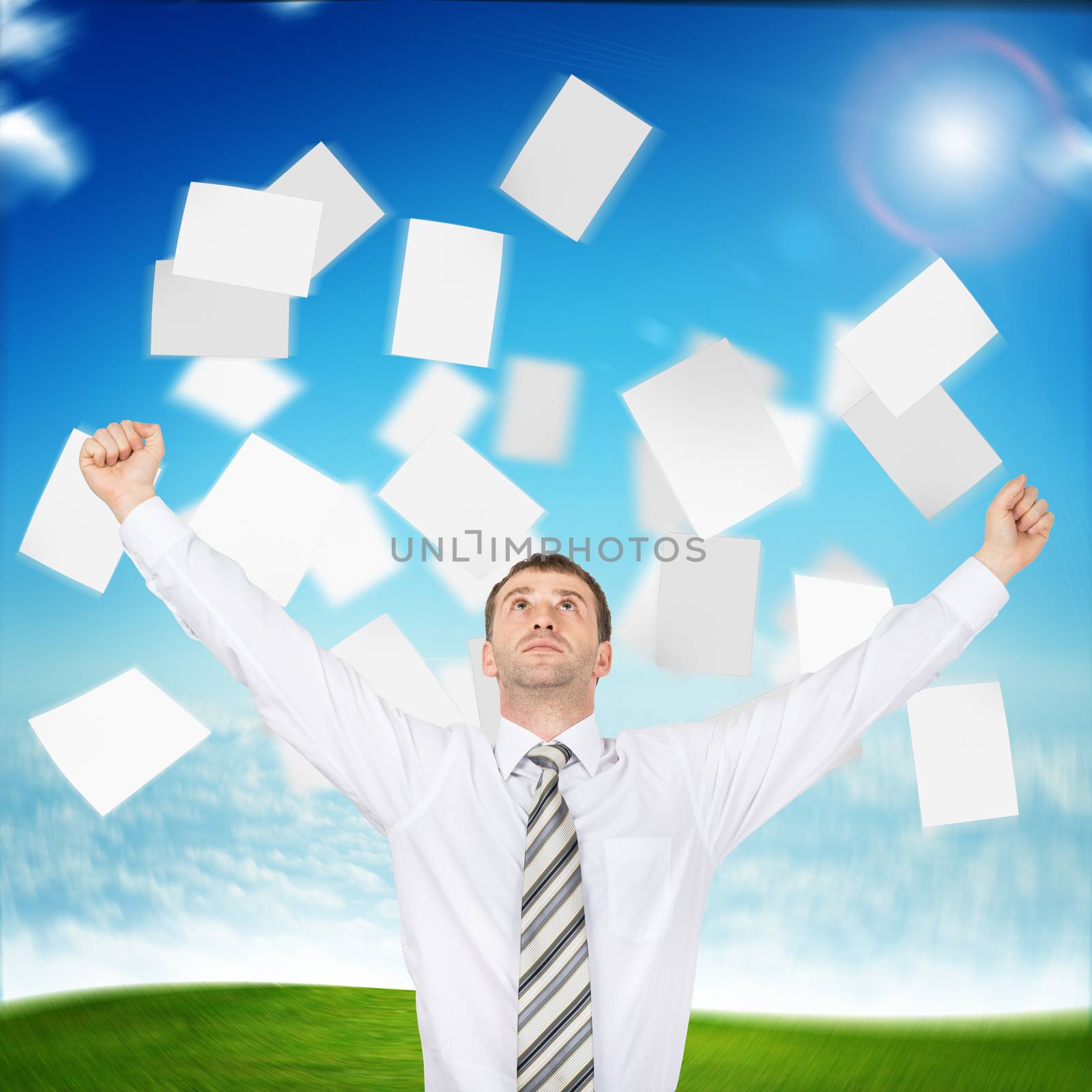 Businessman with paper looking up, freedom concept