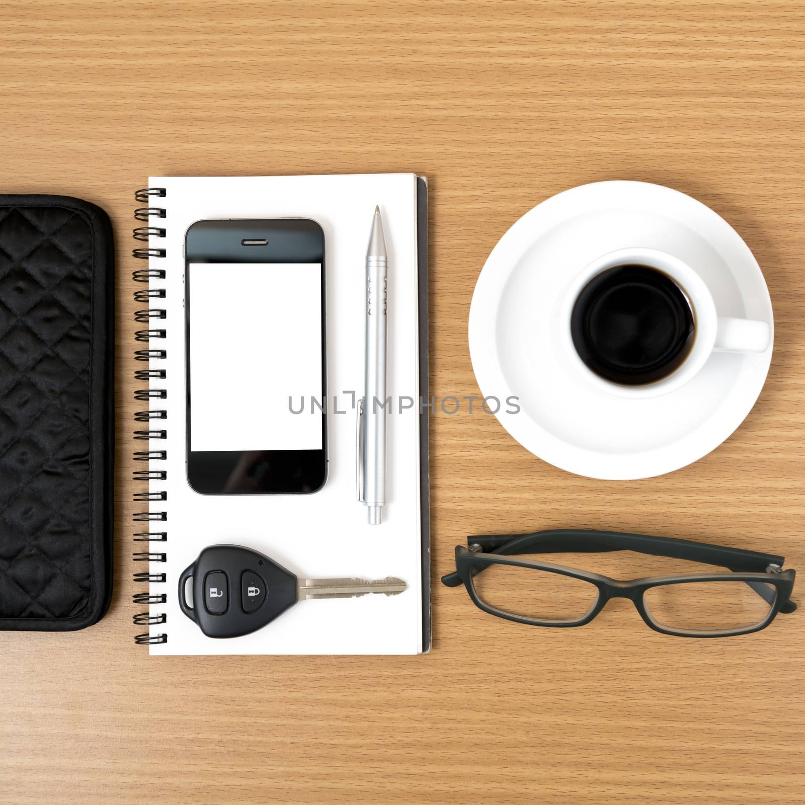 coffee and phone with notepad,car key,eyeglasses and wallet on wood table background