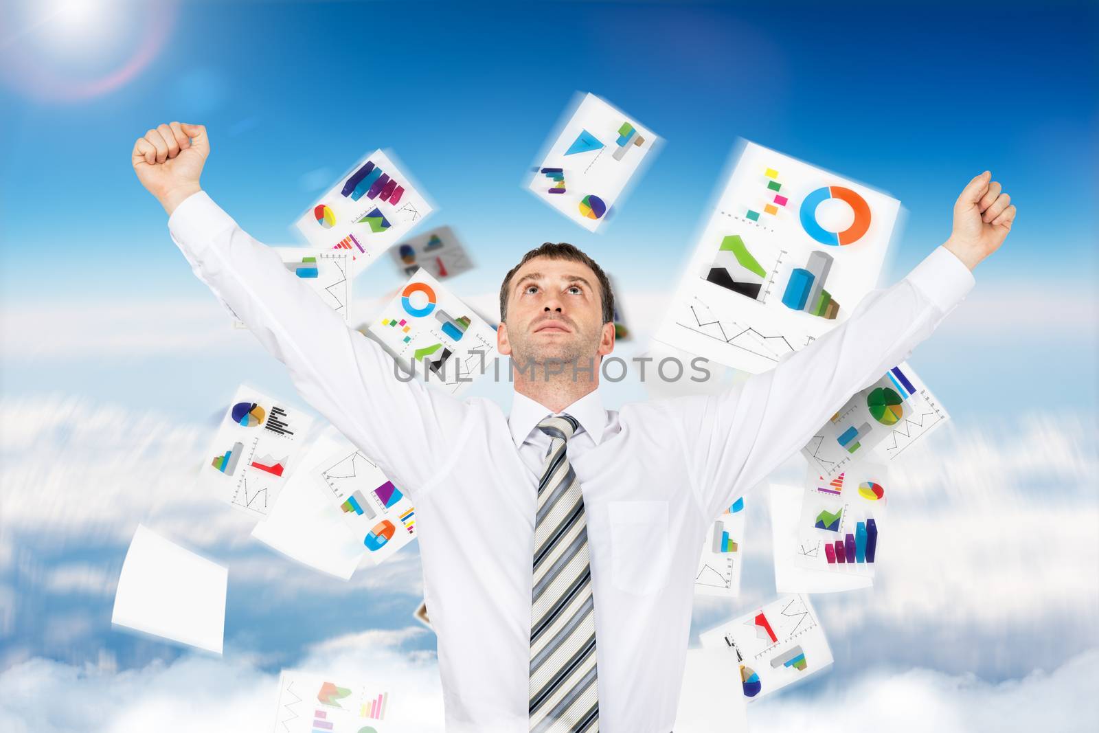 Businessman with paper looking up and graphs, freedom concept