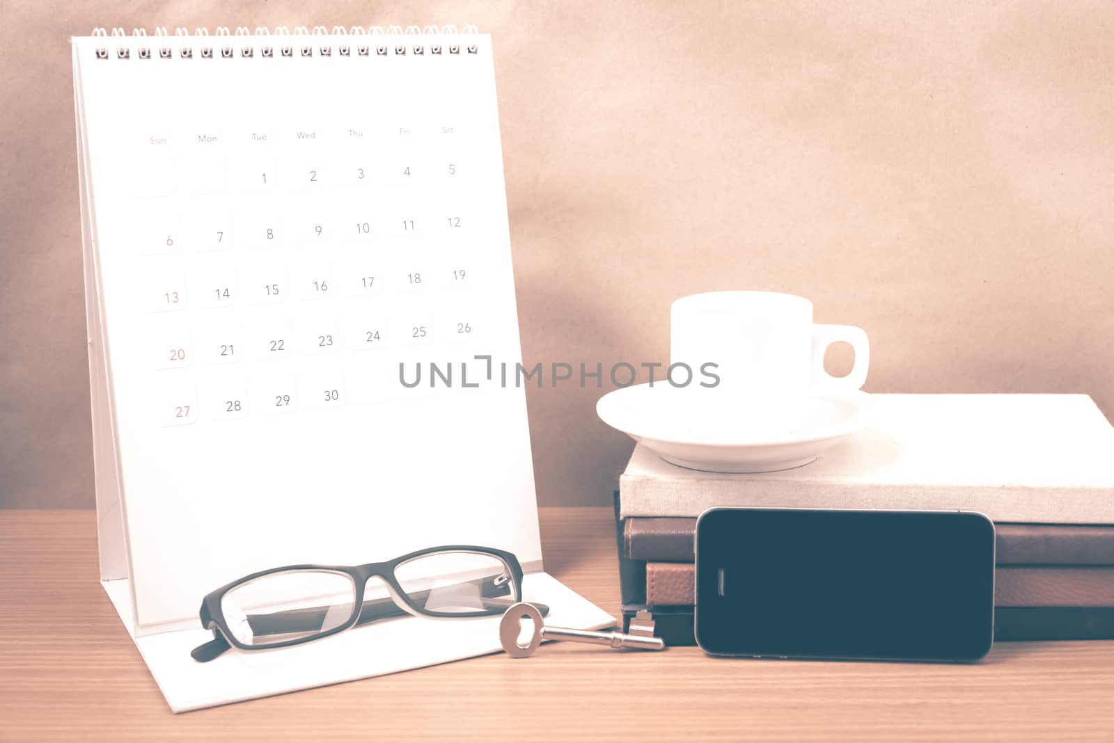 coffee and phone with key,eyeglasses,stack of book,calendar vint by ammza12