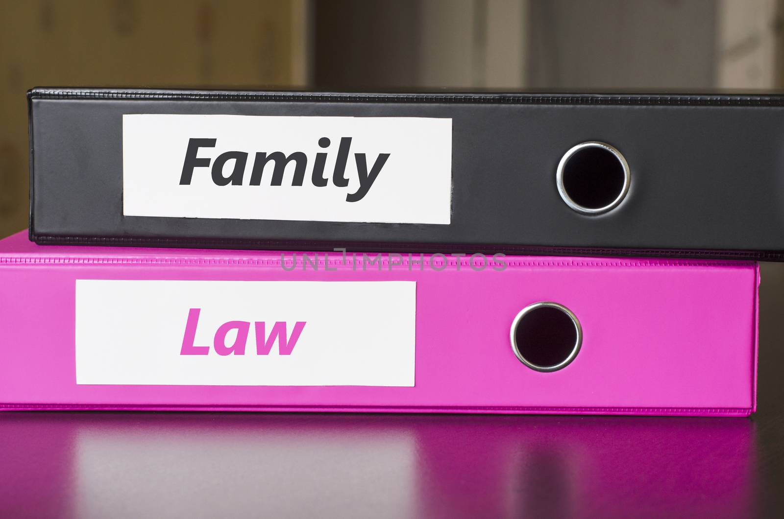 Bright office folders over dark background and family law text concept
