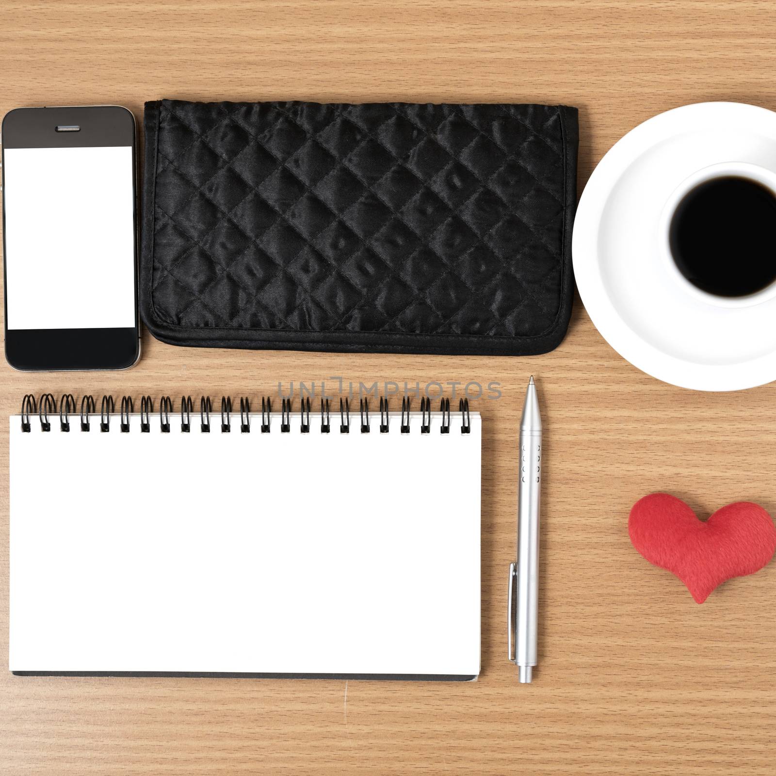 desktop : coffee with phone,notepad,wallet,heart on wood background