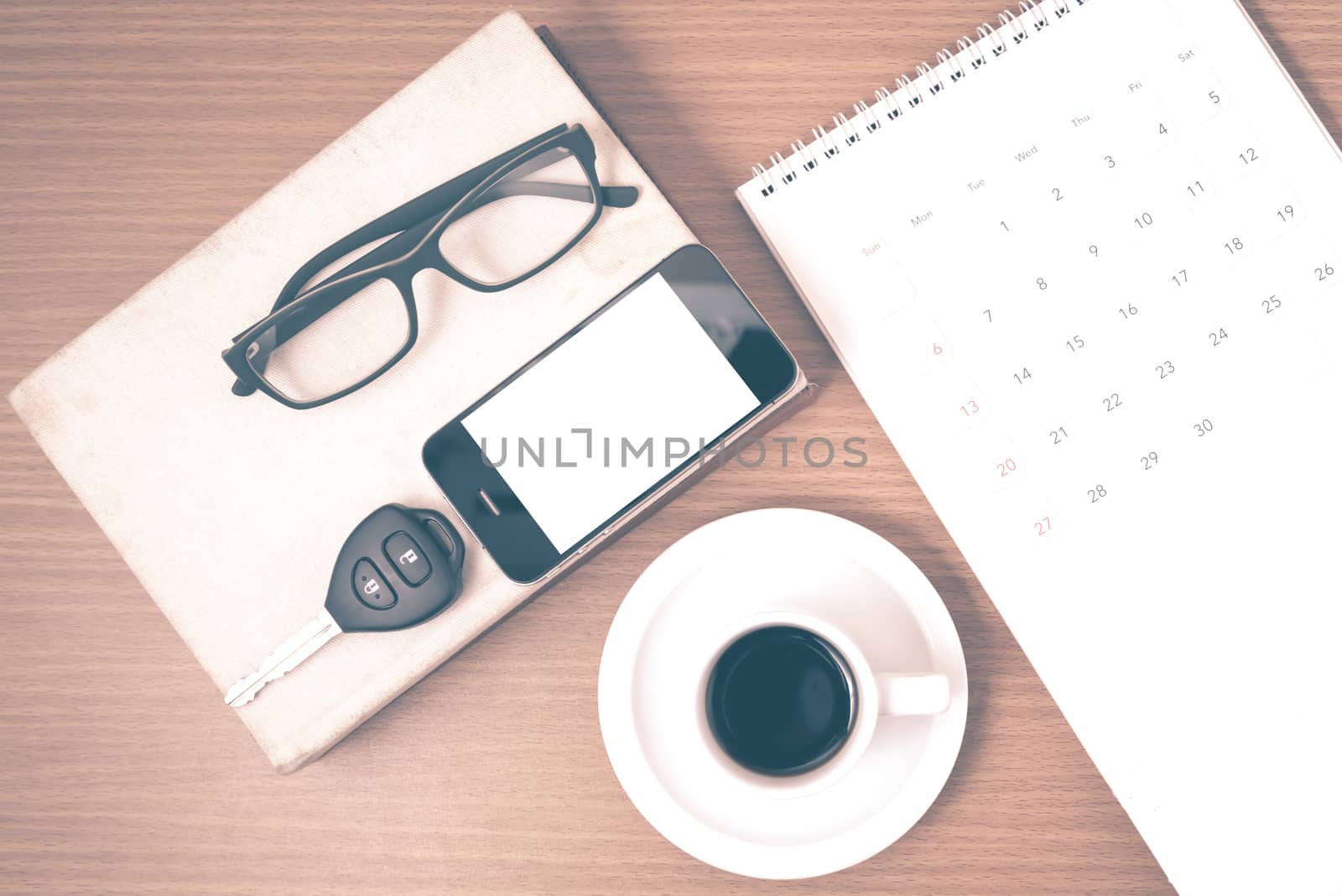coffee and phone with car key,eyeglasses,stack of book,calendar  by ammza12