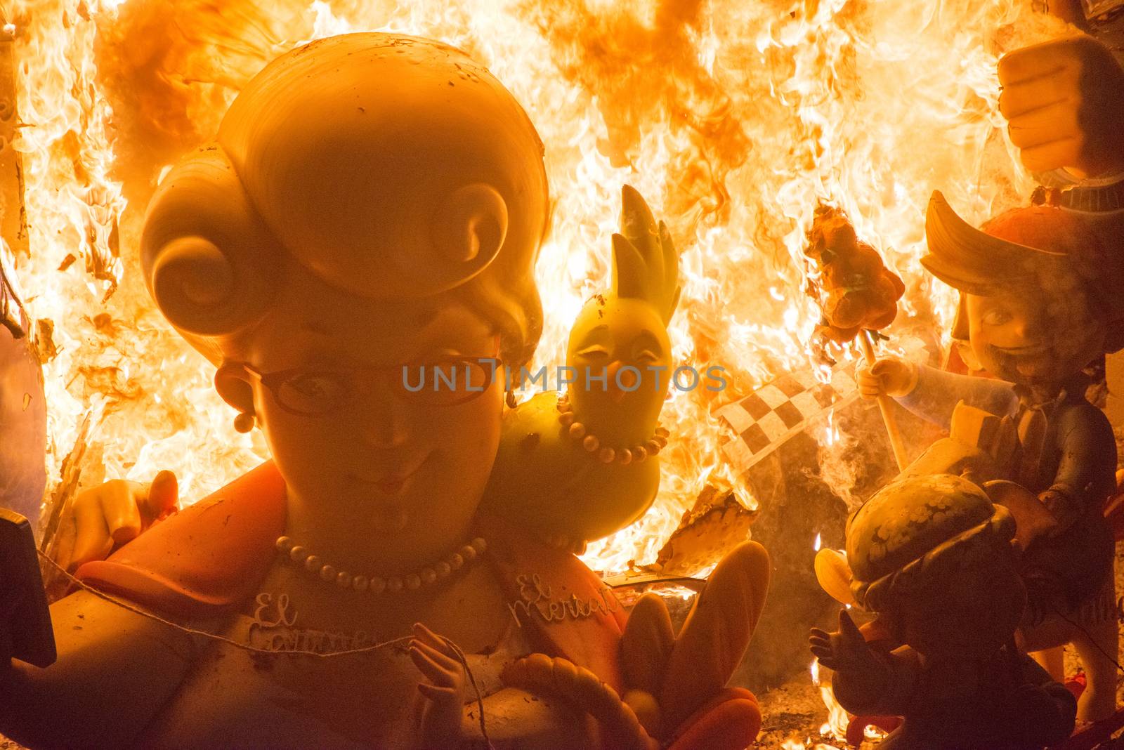 SPAIN, Valencia : Ninots burn on the last night of the Fallas Festival in Valencia on March 19, 2016.Fallas are gigantic structures made of cardboard portraying current events and personalities in which individual figures or Ninots are placed. The Fallas are burnt in the streets of Valencia as a tribute to St Joseph, patron saint of the carpenters' guild. 