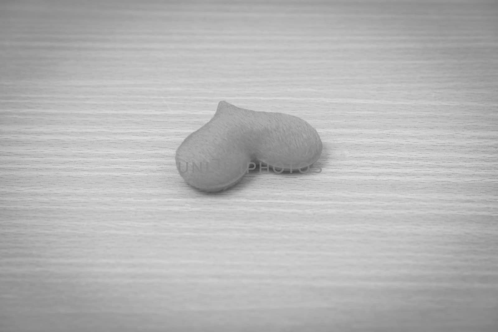 red heart on wood table background black and white color