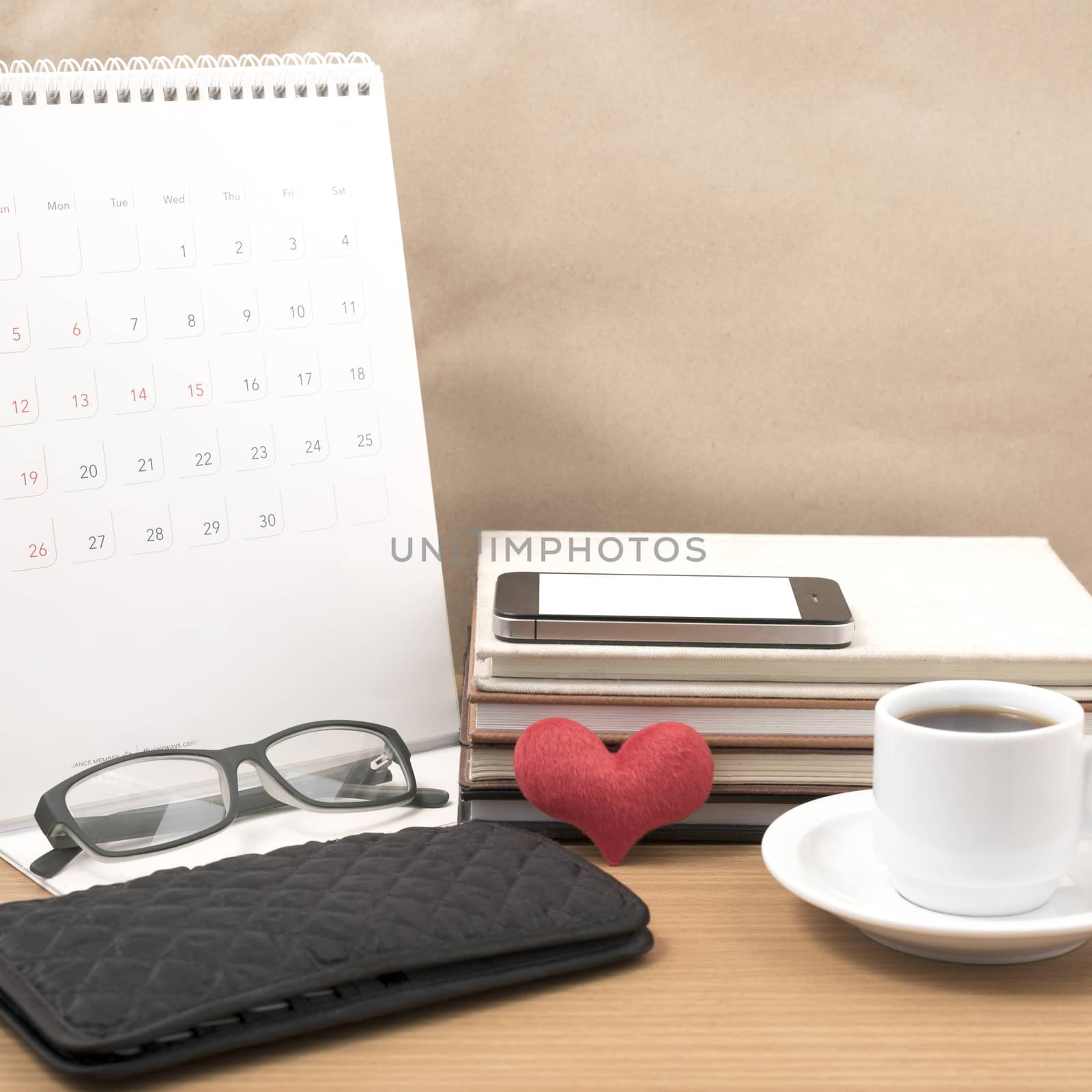 desktop : coffee with phone,stack of book,wallet,heart,eyeglasse by ammza12
