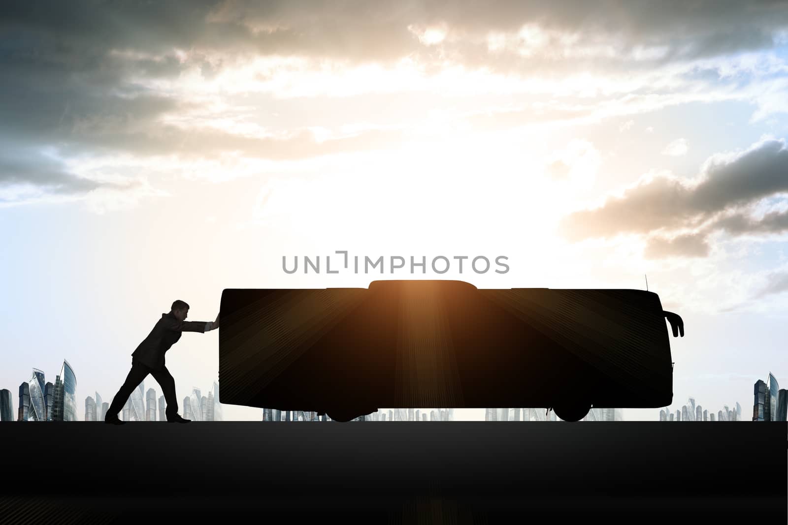 Businessman pushing bus on sunrise background with clouds