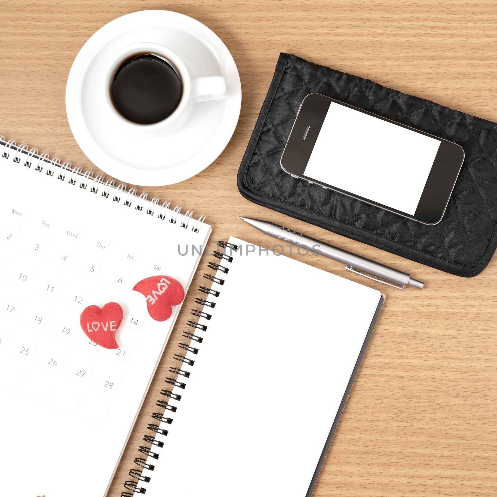 office desk : coffee with phone,wallet,calendar,heart,notepad on wood background