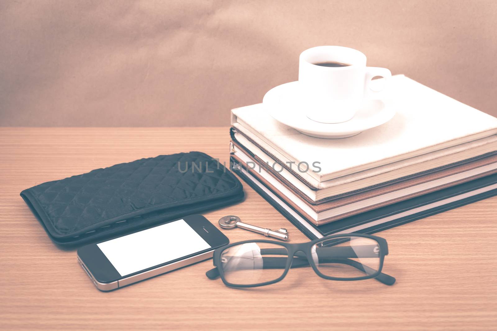 coffee and phone with stack of book,key,eyeglasses and wallet vi by ammza12