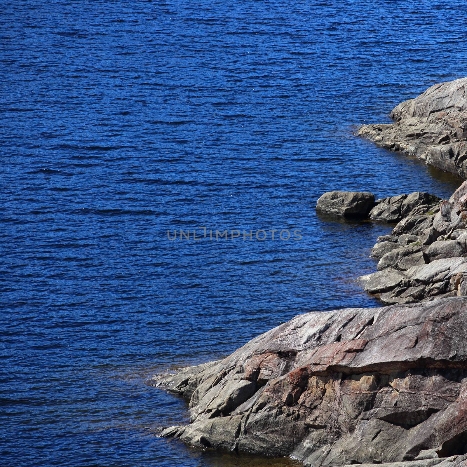 Sea shore with rocks, summer Norway landscape