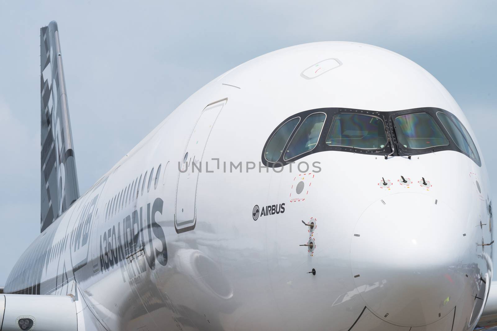 Singapore - February 17, 2016: Front of an Airbus A350 XWB in Airbus factory livery during Singapore Airshow at Changi Exhibition Centre in Singapore.