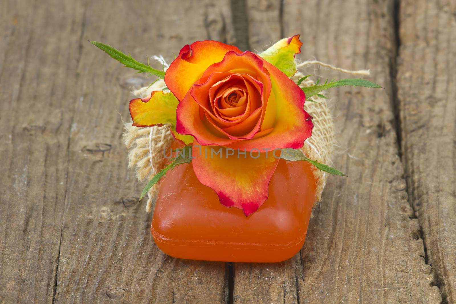 bar of natural soap and rose