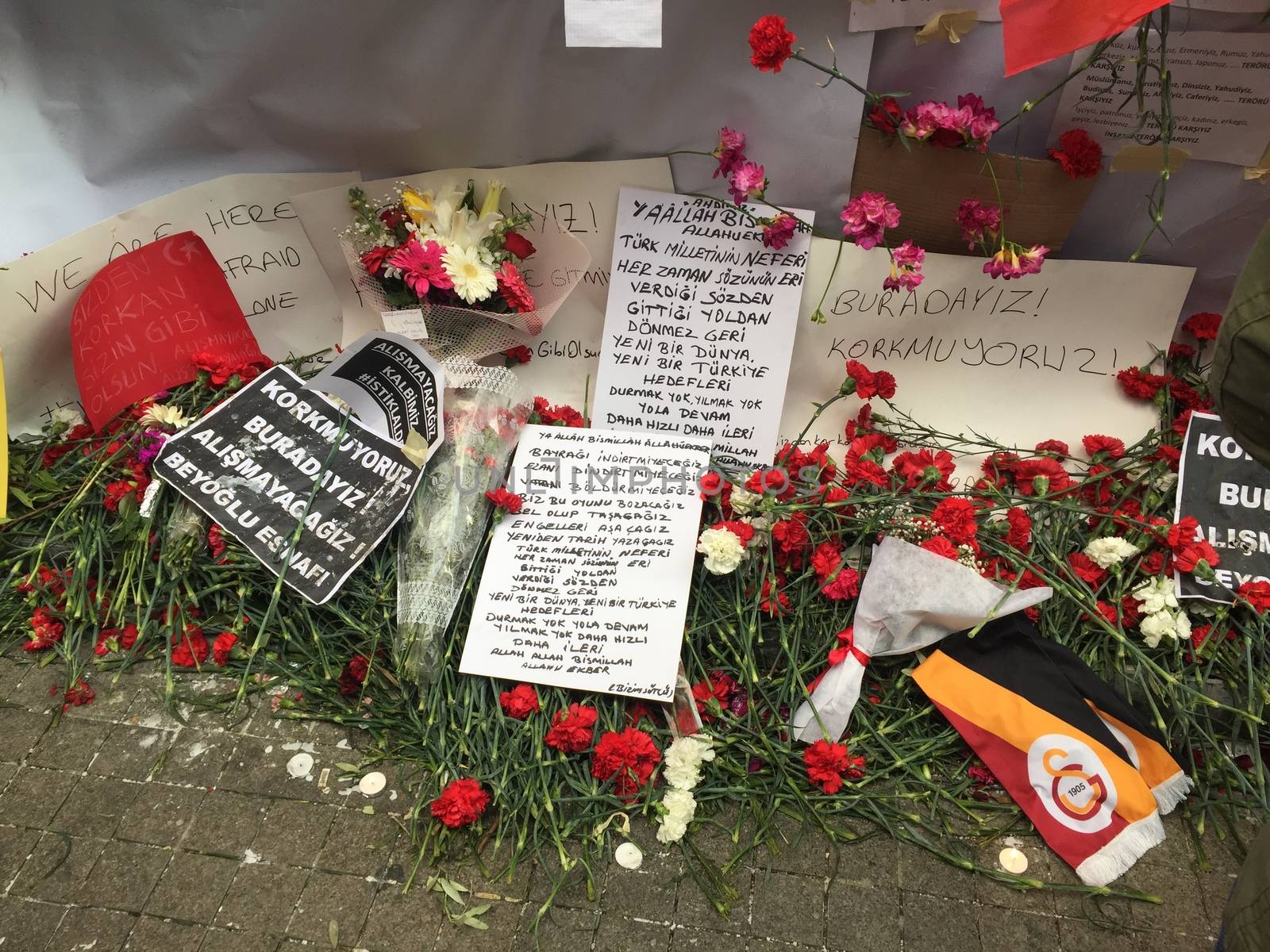 TURKEY, Istanbul: A picture is taken of cards and flowers left at the site of a blast on Istiklal Street, a major shopping and tourist district, in central Istanbul on March 20, 2016 in tribute to four people killed during a suicide blast that ripped through Istanbul less than a week after another deadly attack left 35 dead in Ankara.