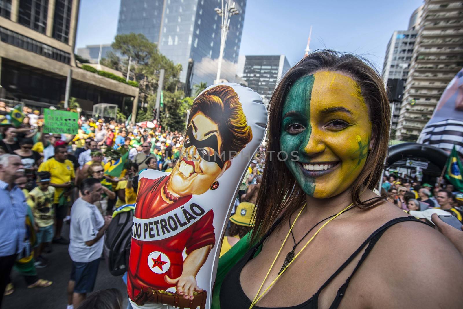 BRAZIL, Sao Paulo: A woman holds a balloon representing President Dilma Rousseff as thousands of protesters demonstrate against Brazilian former president (2003-2011) Luiz Inacio Lula da Silva in Sao Paulo, on March 20, 2016. Brazilian lawmakers relaunched impeachment proceedings against President Dilma Rousseff Thursday and a judge blocked her bid to bring her powerful predecessor into her cabinet, intensifying the political crisis engulfing her.