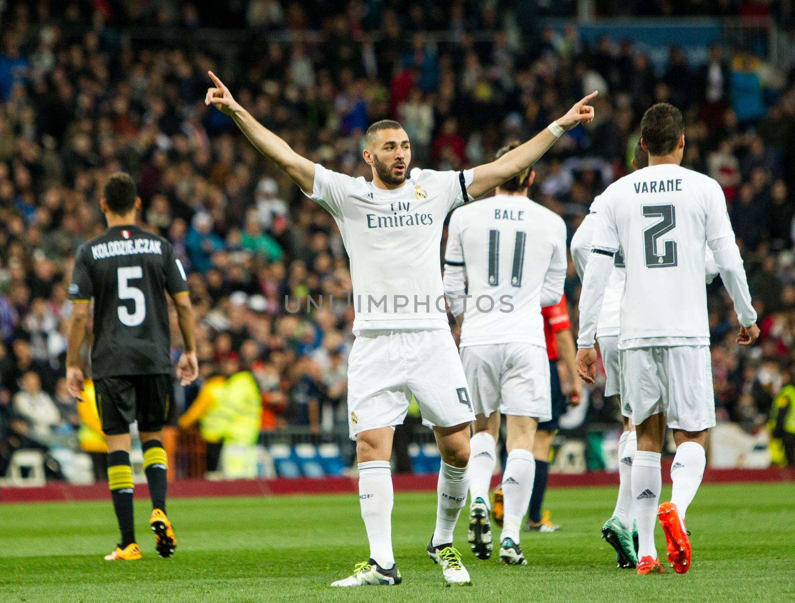 SPAIN, Madrid: Real Madrid's French Karim Benzema celebrates scoring during Spanish Liga football match Real Madrid vs Sevilla at Santiago Bernabeu stadium in Madrid on March 20, 2016.