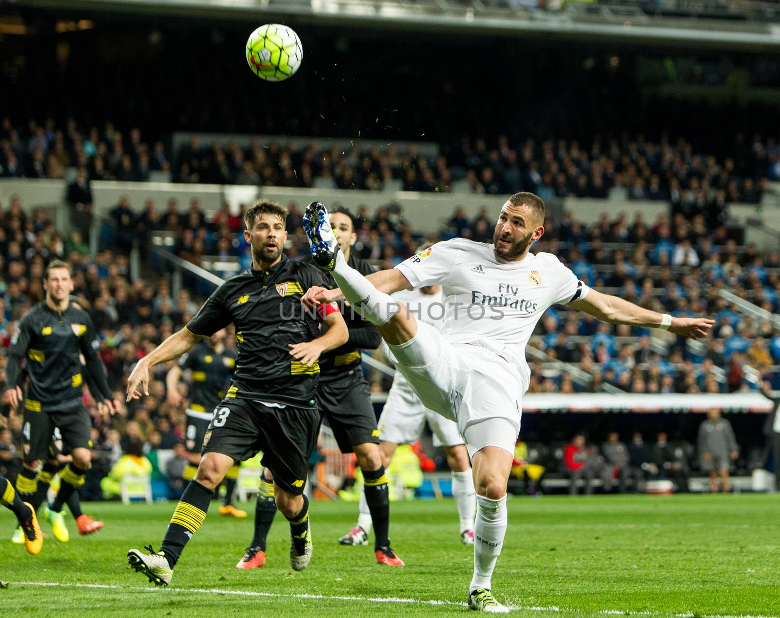 SPAIN, Madrid: Real Madrid's French Karim Benzema (R) in action during Spanish Liga football match Real Madrid vs Sevilla at Santiago Bernabeu stadium in Madrid on March 20, 2016.