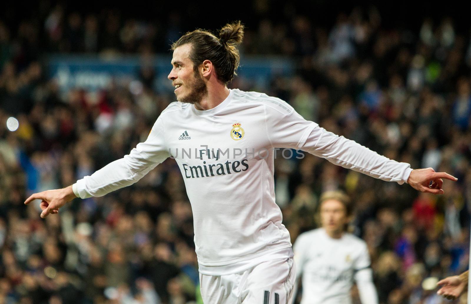 SPAIN, Madrid:  Real Madrid's Welsh forward Gareth Bale  celebrates scoring during Spanish Liga football match Real Madrid vs Sevilla at Santiago Bernabeu stadium in Madrid on March 20, 2016.