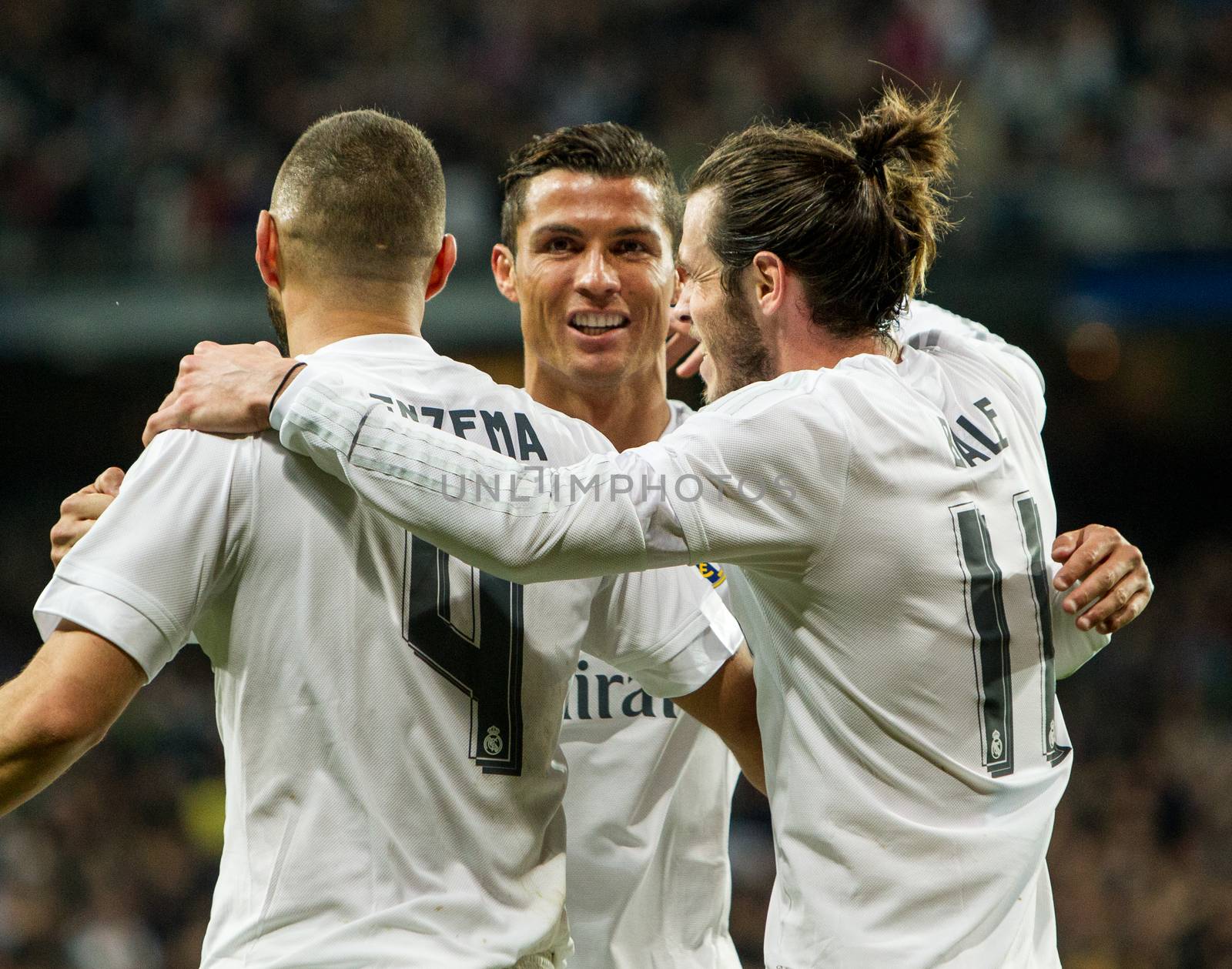 SPAIN, Madrid: Real Madrid's Welsh forward Gareth Bale (R), Real Madrid's French forward Karim Benzema (L) and Real Madrid's Portuguese forward Cristiano Ronaldo (C) celebrate scoring during the Spanish league football match Real Madrid CF vs Sevilla FC at the Santiago Bernabeu stadium in Madrid on March 20, 2016. 
