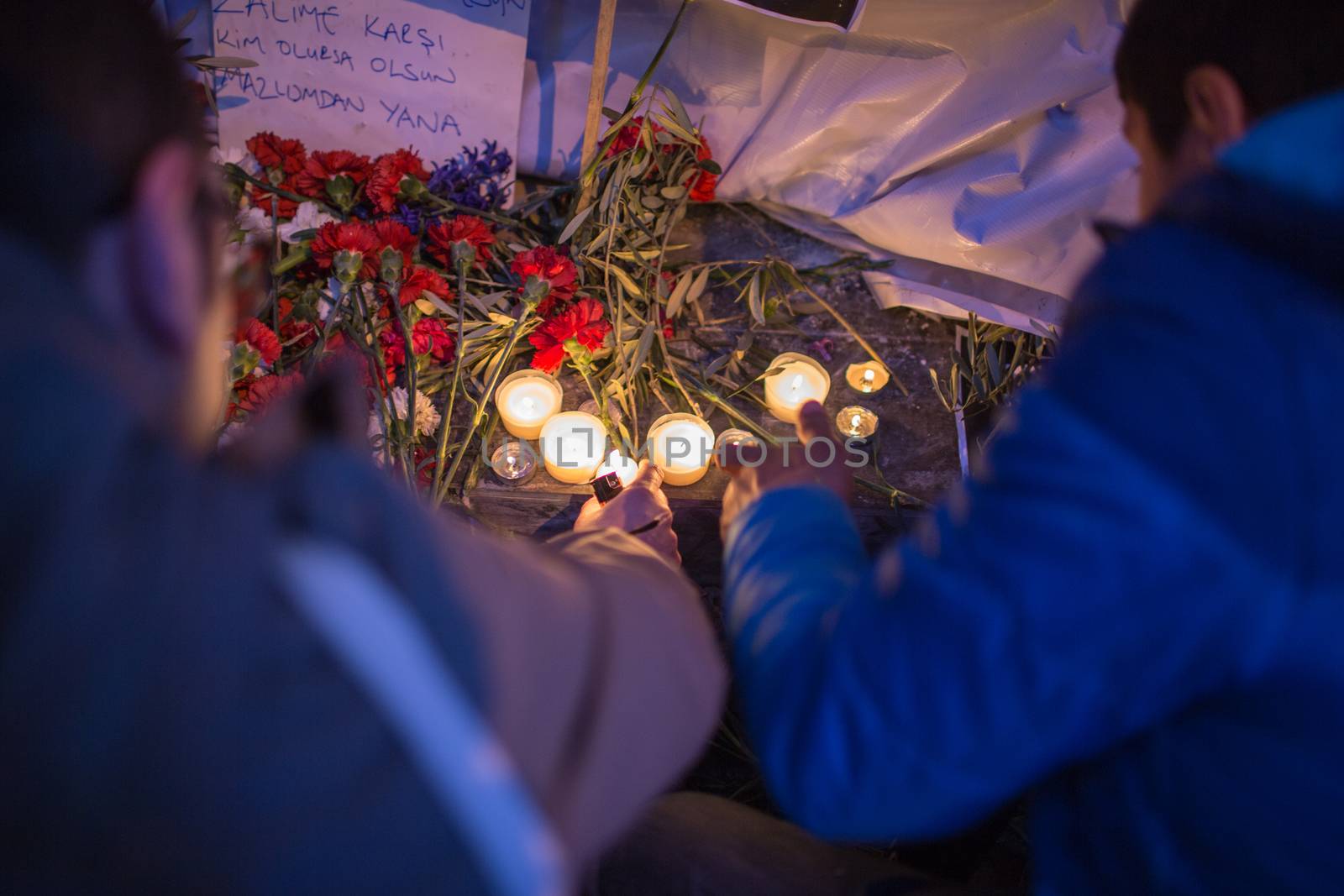 TURKEY, Istanbul: People gather at the site of a blast on Istiklal Street, a major shopping and tourist district, in central Istanbul on March 20, 2016, to pay tribute to four people killed during a suicide blast that ripped through Istanbul less than a week after another deadly attack left 35 dead in Ankara.