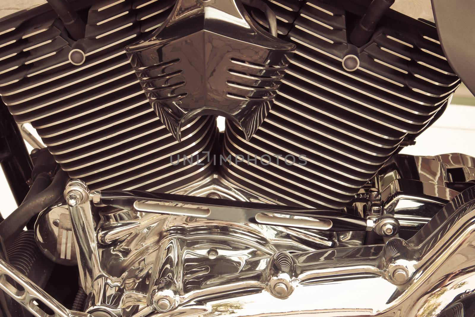 Motorbike's chromed engine background sepia style