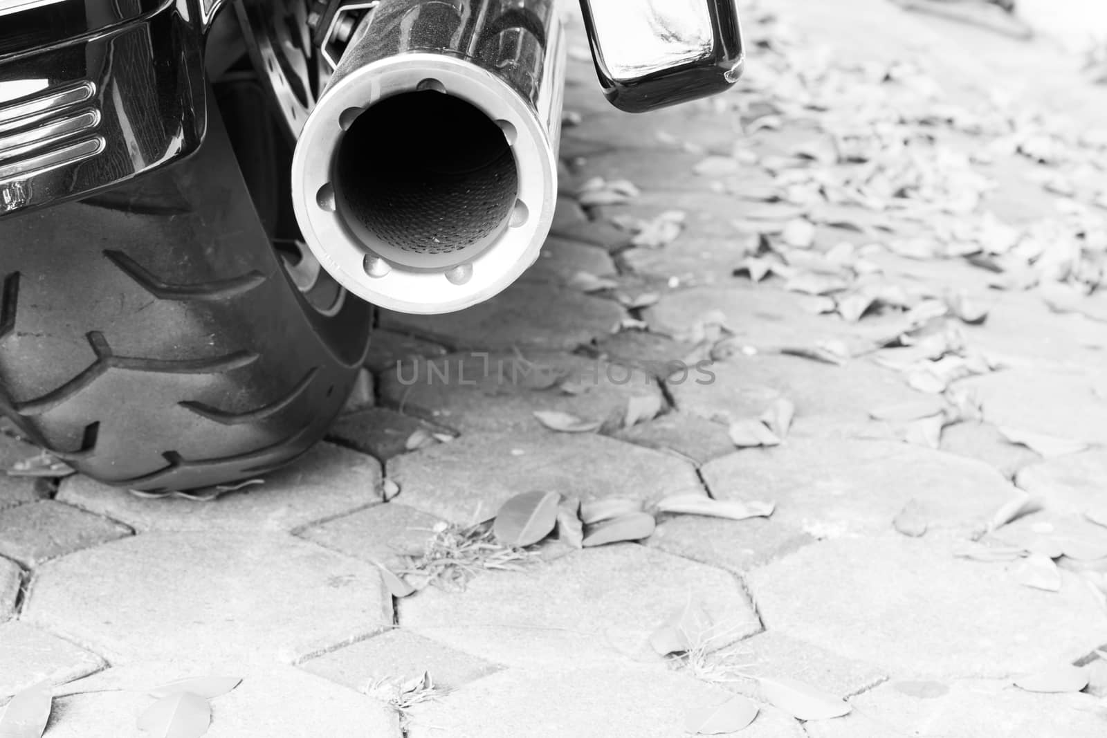 Motorcycle exhaust black and white background by worrayuth