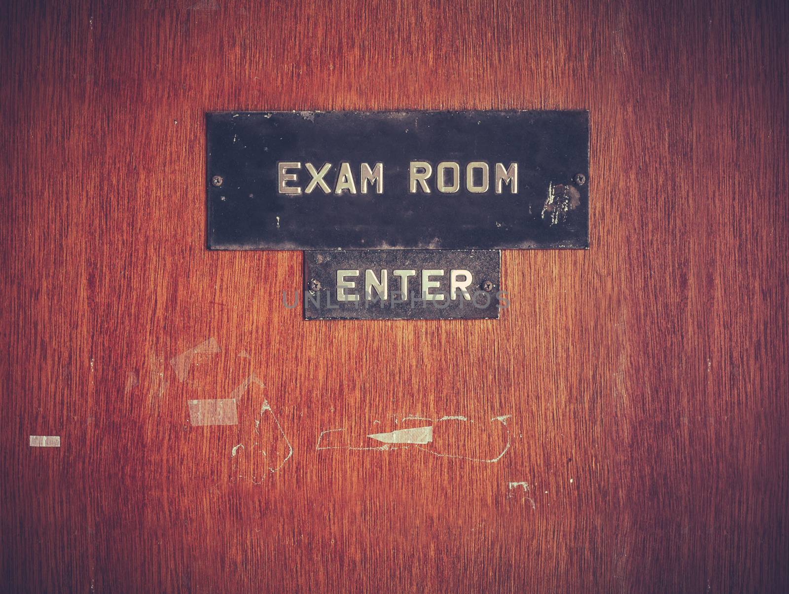 Retro Filtered Image Of A Grungy Exam Room Door At A Public School In The USA