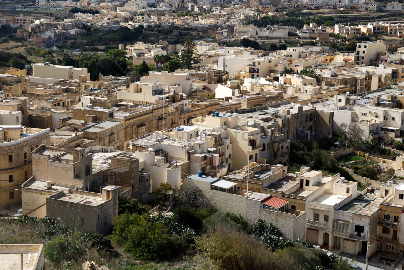 View of Victoria city in Malta, with historical limestone buildings.