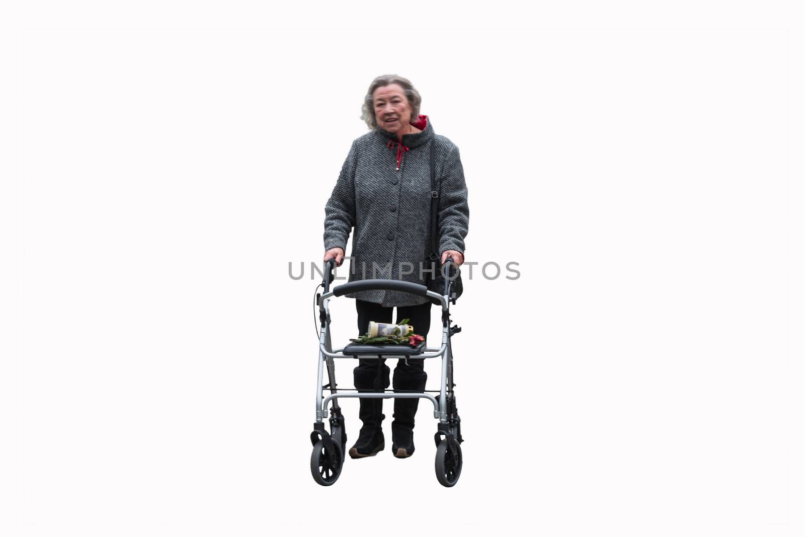 Elderly lady with a walker against white background.