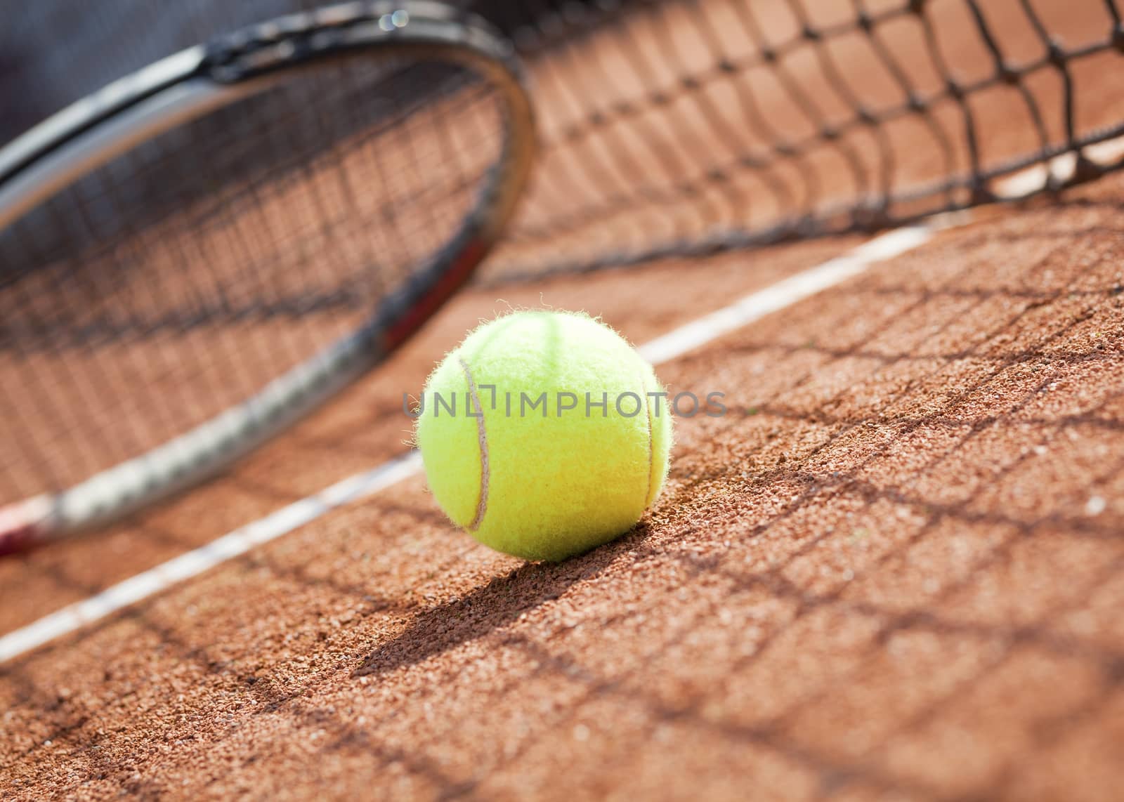tennis background with tennis equipment on clay course