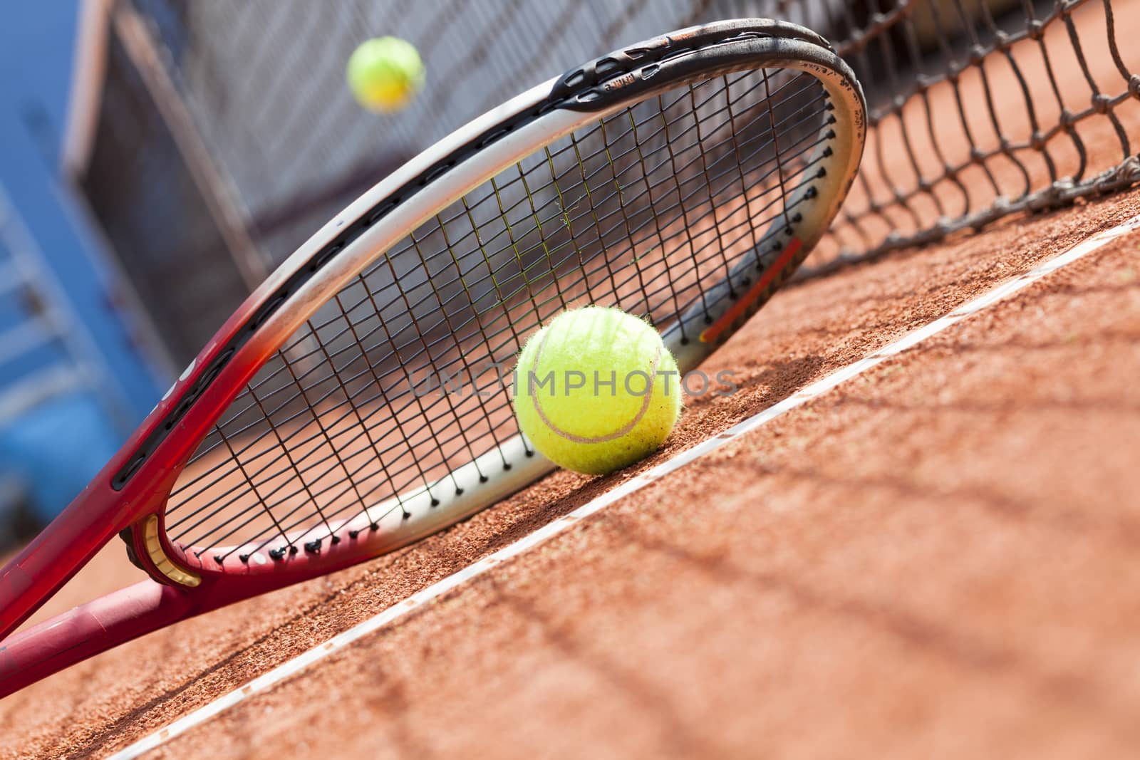 tennis background with tennis equipment on clay course