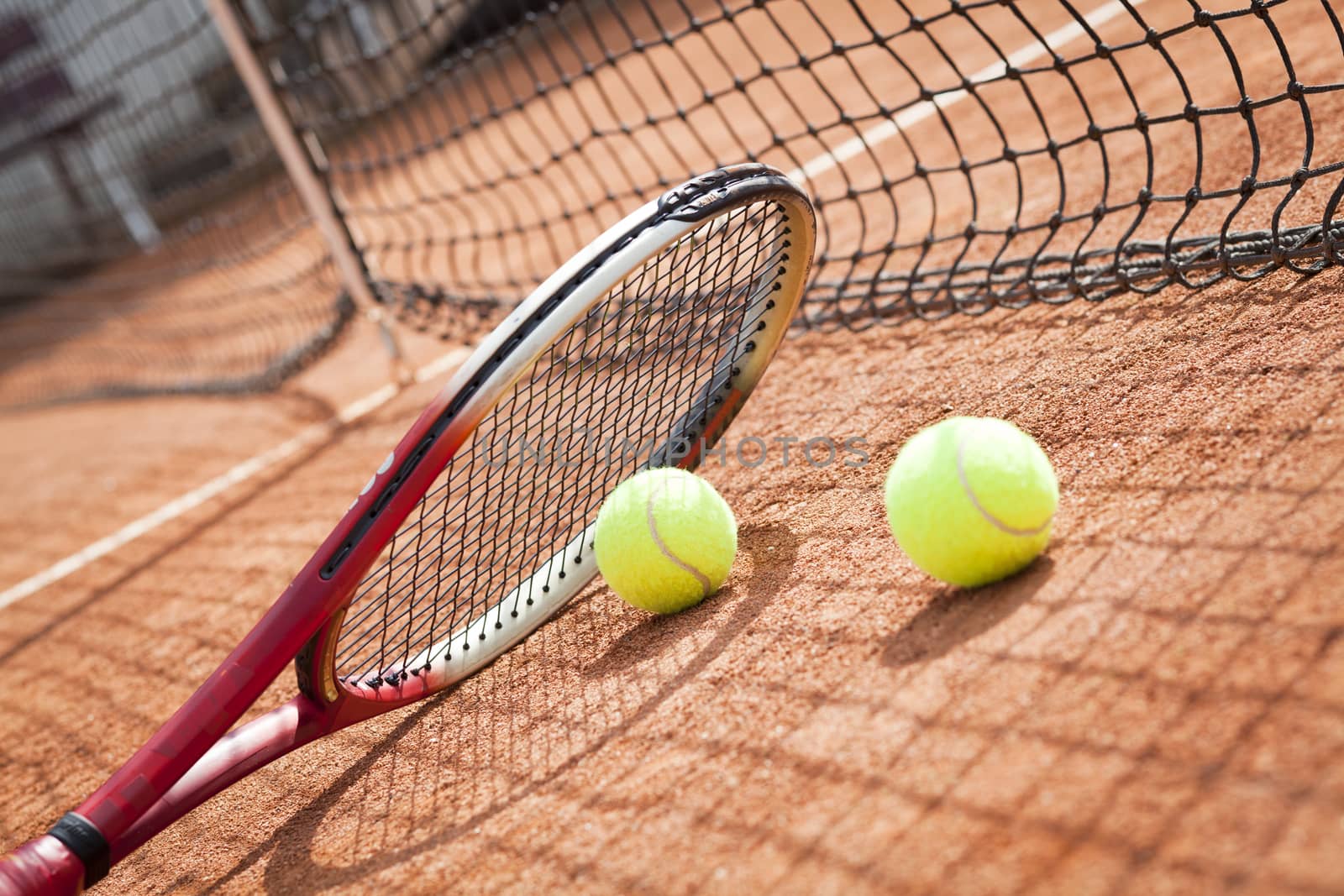 tennis background with tennis equipment on clay course