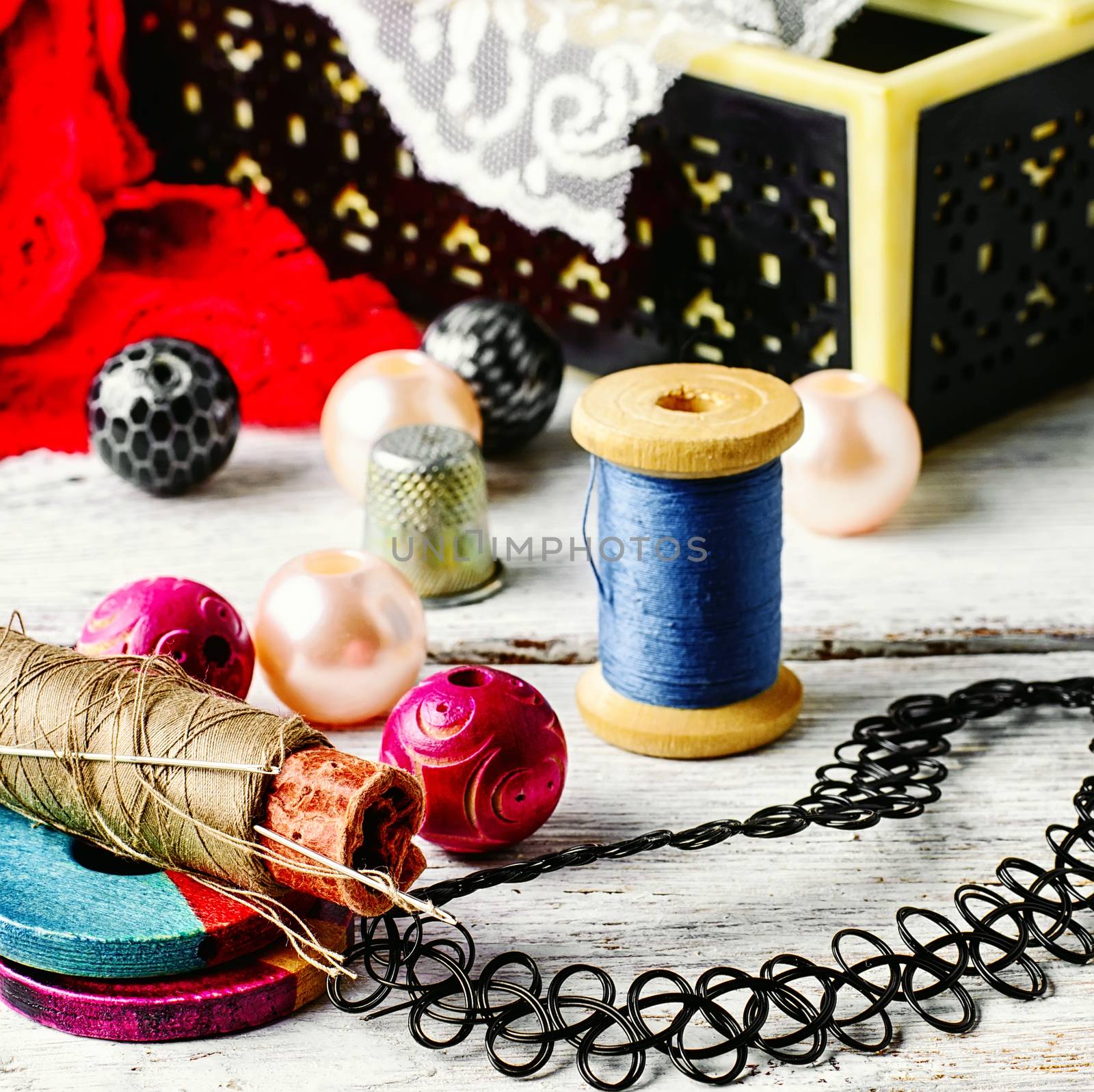 Jewelry and a sewing tool by LMykola