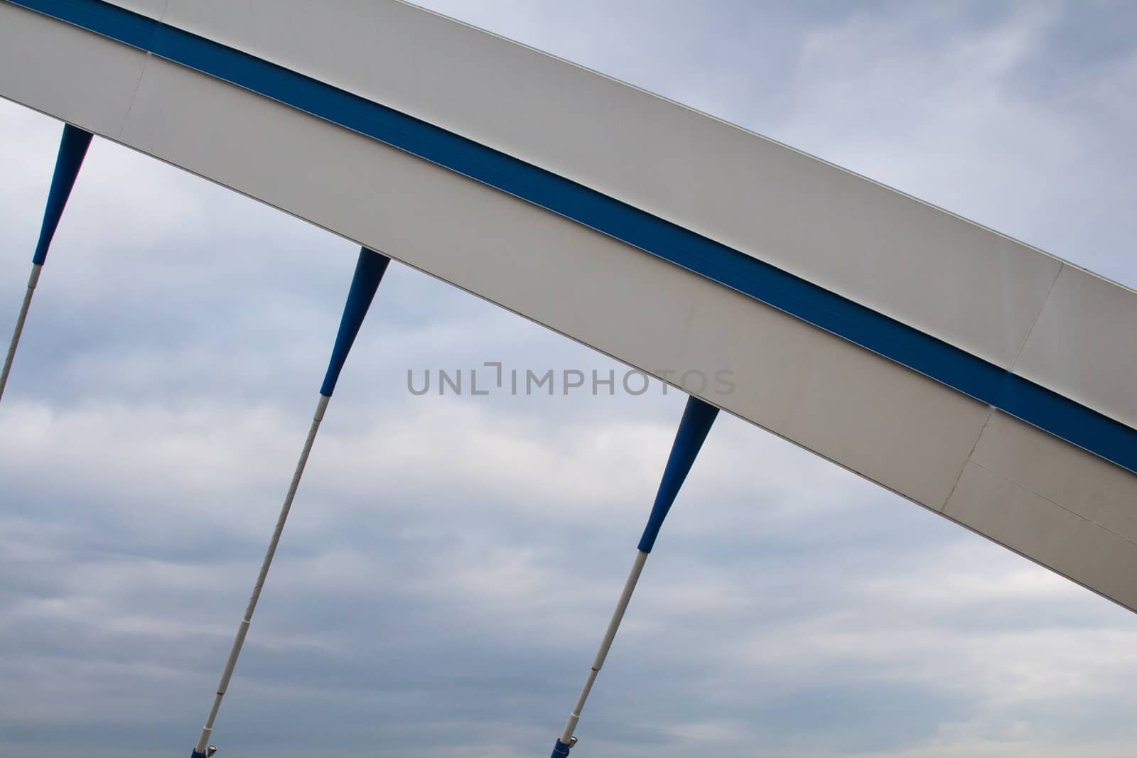 Apollo bridge in Bratislava, Slovakia, uniting banks of river Danube. Details of the construction. Intense clouds on the sky.