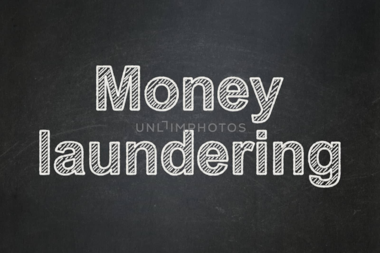 Money concept: Money Laundering on chalkboard background by maxkabakov