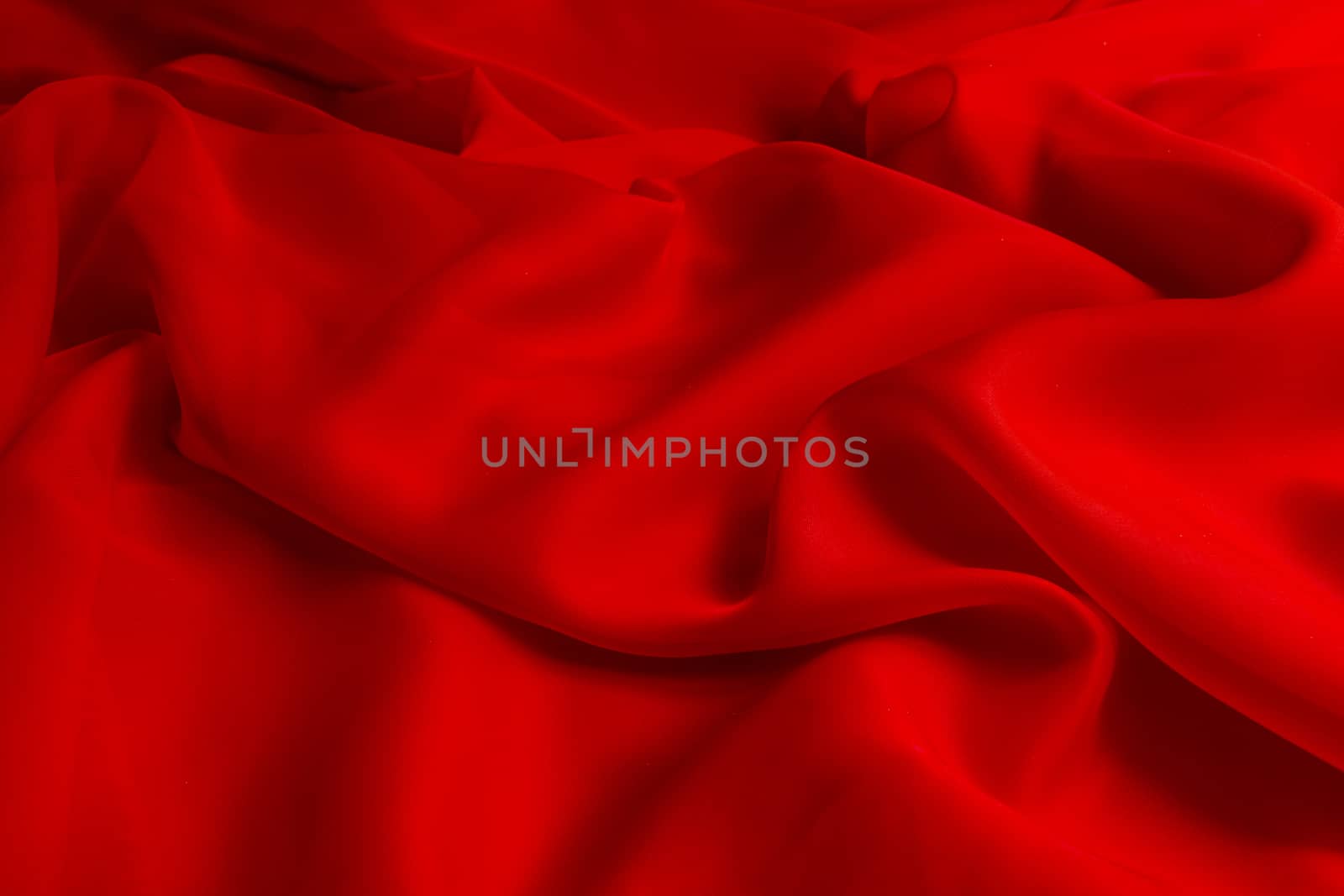 the texture of the red fabric from the delicate chiffon