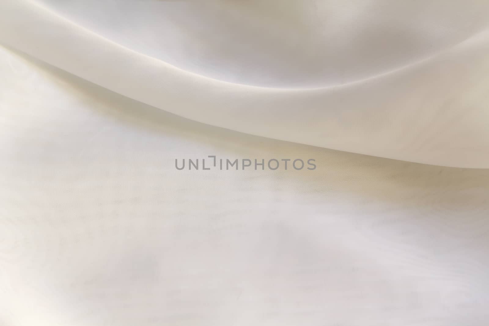 Shiny White silky fabric folds background texture