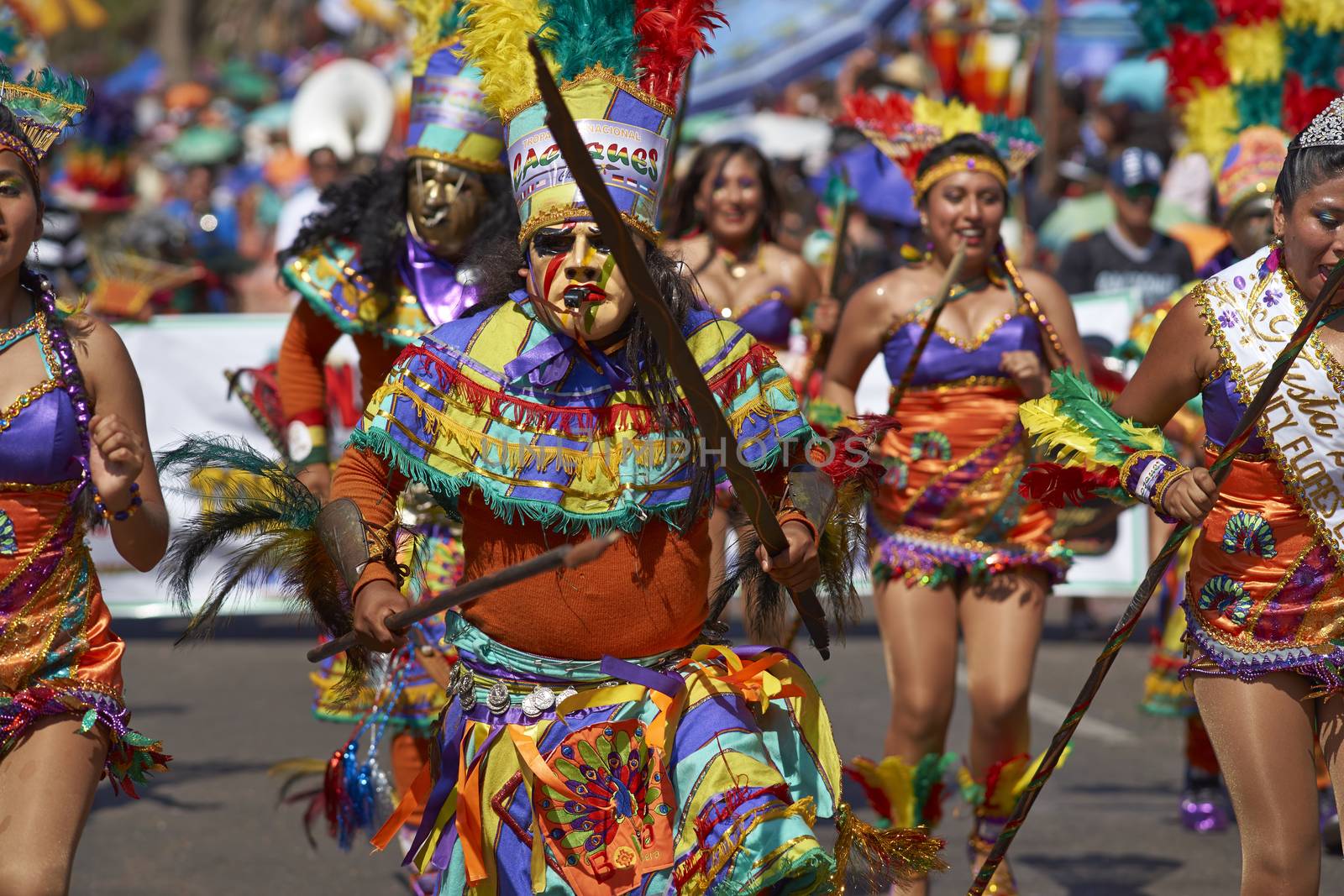 Tobas dance group in traditional Andean costumes performing at the annual Carnaval Andino con la Fuerza del Sol in Arica, Chile.